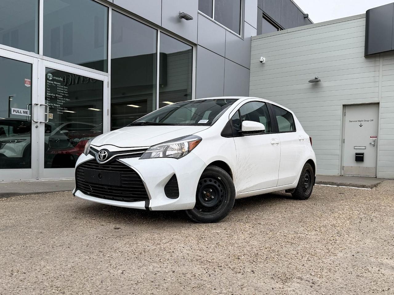 Looking for a reliable, efficient, and stylish compact car? Check out this pre-owned 2017 Toyota Yaris LE 5-door Hatchback in Alpine White with a comfortable Gray interior. Powered by a 1.5L I-4 DOHC 16-Valve VVT-I engine, it delivers a smooth and economical drive with front-wheel drive and a 5-speed manual transmission.This Yaris comes equipped with 15 steel wheels with full covers, fabric bucket seats, and a host of safety features including 9 airbags, electronic stability control, and all-speed ABS with traction control. Stay connected and entertained with the AM/FM CD/MP3 player, steering wheel audio controls, and Bluetooth wireless audio streaming.Additional comforts include power door locks and windows, heated side mirrors, cruise control, manual climate control, and a spacious 60/40 folding rear seat for versatile cargo space. This compact hatchback offers great fuel efficiency, easy maneuverability, and Toyotas renowned durabilityideal for city driving and everyday adventures.Dont miss this well-maintained 2017 Toyota Yaris LEa smart choice for budget-conscious buyers who want reliability without compromising style or features. Contact us today to schedule your test drive!Go Mazda is an AMVIC licensed business,This vehicle is showing a CarFax incident with no reported amount