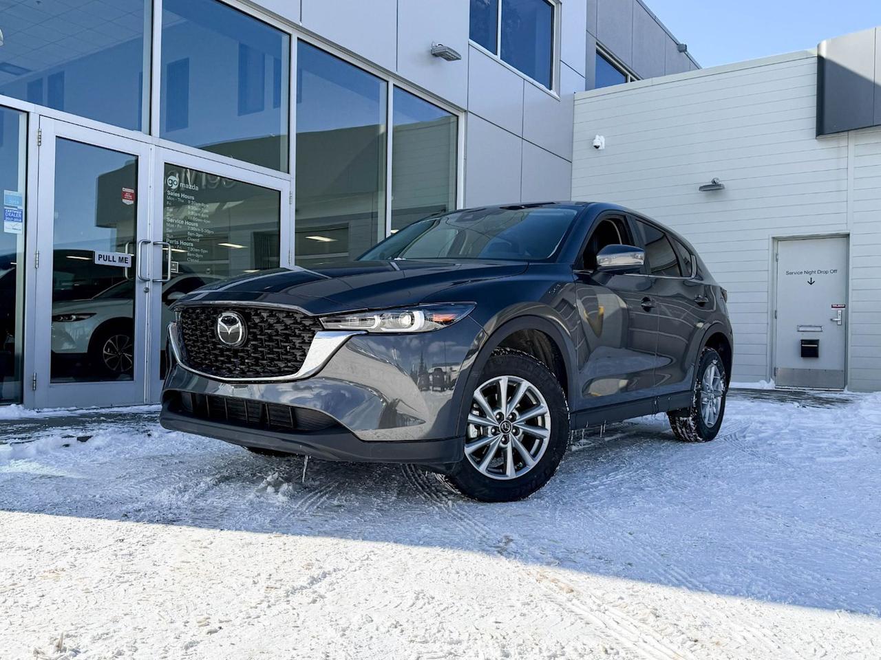 Discover the pre-owned 2024 Mazda CX-5 GS AWD in sophisticated Grey with premium Black leatherette interior. Powered by a 2.5L SKYACTIV-G engine paired with a smooth 6-speed automatic transmission and full-time AWD, this SUV delivers responsive performance and all-weather confidence.Enjoy heated front seats, dual-zone automatic climate control, and advanced tech, including a 10.2-inch display with wireless audio streaming and smart device mirroring. Safety is paramount with lane departure prevention, blind spot warning, forward collision mitigation, and a rearview camera.Ride in comfort and style on 17 silver alloy wheels with projector-beam LED headlights and sleek body accents. With ample cargo space, power liftgate, and thoughtful convenience features, the CX-5 GS is your perfect companion for every journey.Visit Go Mazda today to test drive this versatile and well-equipped CX-5  where style meets functionality!Go Mazda is an AMVIC licensed business.Please note this vehicle was previously used as a Rental.