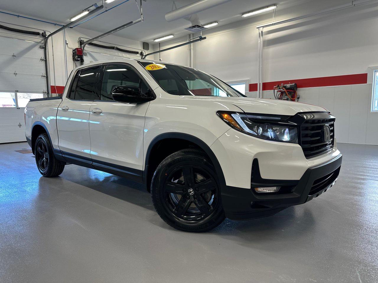 <span>The Honda Ridgeline is the pickup truck that just makes sense, and it makes sense in an especially big way in this top-spec 2022 Black Edition. At its core, the 2022 Ridgeline is an enormously versatile truck: 5,000 pounds of towing capacity, a 1,485-pound payload capacity, a tailgate that opens two different ways, and a gigantic in-bed trunk.</span>




<span>The updated 2022 Ridgeline benefits from revamped styling and improved infotainment. As a Black Edition, extras include unique leather upholstery along with red ambient lighting. There are also 18-inch black alloys, black door handles, and a black chrome grille. Equipment in the top-of-the-line Ridgeline is extensive, including heated seats (front&nbsp;<em>and&nbsp;</em>rear) plus ventilated front seats, truck-bed audio, rain-sensing wipers, memory settings for the drivers power functions, navigation, blind spot monitoring, auto high beams, 8-speaker 540-watt audio, and an in-bed power outlet.</span>




<span>Theres also an acoustic windshield, heated steering wheel, integrated remote start, sunroof, power sliding rear window, tri-zone automatic climate control, 10-way power drivers seat, and Apple CarPlay/Android Auto. Theres also a full suite of Honda Sensing tech: adaptive cruise, lane keeping assist, forward collision warning, etc.</span>




<span style=font-weight: 400;>Thank you for your interest in this vehicle. Its located at Centennial Honda, 515 Central Street, Summerside, PEI. We look forward to hearing from you; call us toll-free at 1-902-436-9158.</span>