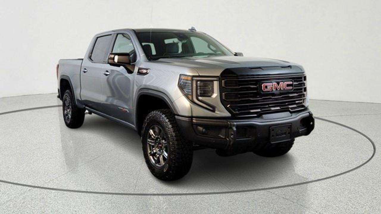 The 2026 GMC Sierra 1500 AT4X is a premium off-road-focused pickup that combines rugged capability with advanced engineering. Features front and rear electronic locking differentials, Multimatic DSSV dampers, and a factory-installed suspension lift for superior performance on challenging terrain. Its equipped with a 6.2L V8, along with impressive towing capability and specialized off-road hardware like skid plates and an AEV steel front bumper with winch capability. Inside, the AT4X delivers a high-end experience with full-grain leather seating, 16-way power heated and ventilated seats with massage, and advanced technology including a 13.4-inch infotainment system with Google built-in and a 12.3-inch digital driver display.