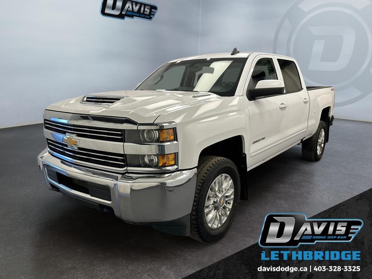 <b>Aluminum Wheels, Remote Keyless Entry, Touch Screen, EZ-Lift Tailgate, Cruise Control!<br /> <br /></b><br /> The 2018 Chevrolet Silverado 2500HD LT is a heavy-duty 4x4 pickup built for serious towing, hauling, and long-term durability. Powered by a proven HD drivetrain with a 4.10 rear axle ratio, electronic shift transfer case, heavy-duty locking rear differential, and fully boxed frame, this Silverado is engineered to handle demanding work with confidence. Its suspension package, 720 CCA heavy-duty battery, auxiliary transmission and engine oil coolers, and 4-wheel disc brakes with DuraLife rotors enhance capability and reliability in tough conditions.<br /><br />Inside, the Silverado 2500HD LT offers a functional and comfortable cabin with a 6-gauge instrument cluster, 4.2-inch driver information display, rear 60/40 folding bench seat, and illuminated vanity mirrors. Practical features like power accessories, cruise-ready instrumentation, and Chevrolet Connected Access add everyday convenience, while Teen Driver mode and a rear vision camera (if equipped) enhance safety awareness and control.<br /><br />On the exterior, this Silverado features a bold chrome grille and bumpers, deep-tinted glass, projector-beam halogen headlamps, EZ-Lift and Lower tailgate, cargo box lighting, and rear CornerStep bumper design for easier bed access. With its strong capability, durable construction, and classic Silverado styling, the 2018 2500HD LT is an ideal choice for work trucks, towing, and commercial use.<br /> <br />To apply right now for financing use this link: <a href=https://lethbridge.davisdodge.ca/free-credit-check/ target=_blank rel=nofollow noopener noreferrer>https://lethbridge.davisdodge.ca/free-credit-check/</a><br /> <br /><br />Locally Owned & Trusted for Over 35 Years  Davis Dodge in Lethbridge, AB <br /><br /> At Davis Dodge, weve proudly served the Lethbridge community for more than 35 years, offering an unparalleled car buying experience. Dont just take our word for itour Google reviews speak volumes about our commitment to exceptional service. <br /><br /> Delivery & At-Home Test Drives: Convenient options to suit your lifestyle. <br /><br /> Flexible Financing for Everyone: Get the vehicle you need with financing solutions tailored to your situation. <br /><br /> Full Mechanical Inspections & Professional Cleaning: Every vehicle is thoroughly inspected and cleaned before it hits our lot.<br /><br /> We take all makes and models on trade and offer competitive pricing with inventory that changes daily. Whether you're shopping for a Chrysler, Dodge, Jeep, RAM, or FIAT, our AMVIC Licensed dealership makes it easy to browse, buy, and drive away.<br /><br /> Located in Lethbridge, AB, we proudly serve customers in Fort Macleod, Taber, Claresholm, and Coaldale. Shop online or visit us today to experience the best in sales, service, and selection. Standard bank rates apply; taxes are additional.<br /><br /> Vehicle pricing offer shown expires 2026-05-31. <br /> Come by and check out our fleet of 60+ used cars and trucks and 110+ new cars and trucks for sale in Lethbridge. o~o