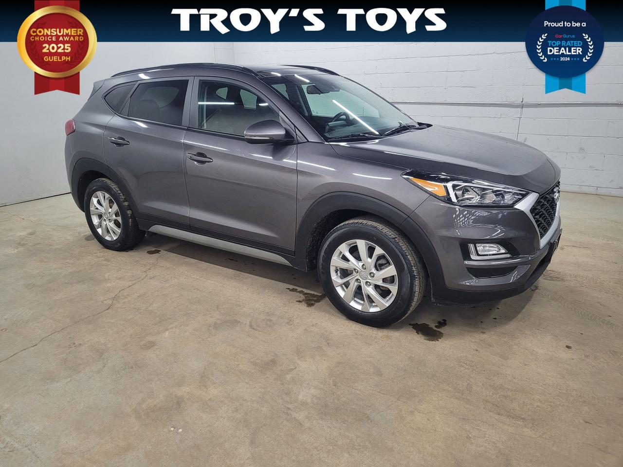 <p>Cruise the Canadian countryside in style with this well-maintained 2020 Hyundai Tucson Preferred, available now at Troys Toys. This versatile SUV, boasting a sleek gray exterior and a comfortable black interior, is ready for your next adventure. With its reliable automatic transmission and all-wheel-drive, the Tucson offers confident handling in any weather, making it the perfect choice for navigating city streets or exploring off the beaten path. This Tucson has a current odometer reading of 179,785km.</p><p>This Tucson Preferred is packed with features designed to enhance your driving experience. The spacious interior provides ample room for passengers and cargo, while the responsive engine delivers a smooth and efficient performance. From daily commutes to weekend getaways, the 2020 Hyundai Tucson Preferred offers the perfect blend of practicality, comfort, and style.</p><p>Here are five features that make this Tucson a standout:</p><ul><li><strong>All-Wheel Drive:</strong> Conquer any road condition with the confidence of all-wheel drive.</li><li><strong>Automatic Transmission:</strong> Enjoy effortless driving with a smooth and responsive automatic transmission.</li><li><strong>Spacious Interior:</strong> Plenty of room for passengers and cargo ensures comfortable journeys for everyone.</li><li><strong>Sleek Exterior:</strong> Turn heads wherever you go with its stylish and modern design.</li><li><strong>Reliable Performance:</strong> Experience a smooth and efficient ride, perfect for everyday driving.</li></ul><p><strong><em>Powered by AutoIntelligence&trade;</em></strong> Vehicle information has been generated using artificial intelligence and is provided for informational purposes only. While efforts are made to ensure accuracy, please confirm all details directly with the dealer.</p>