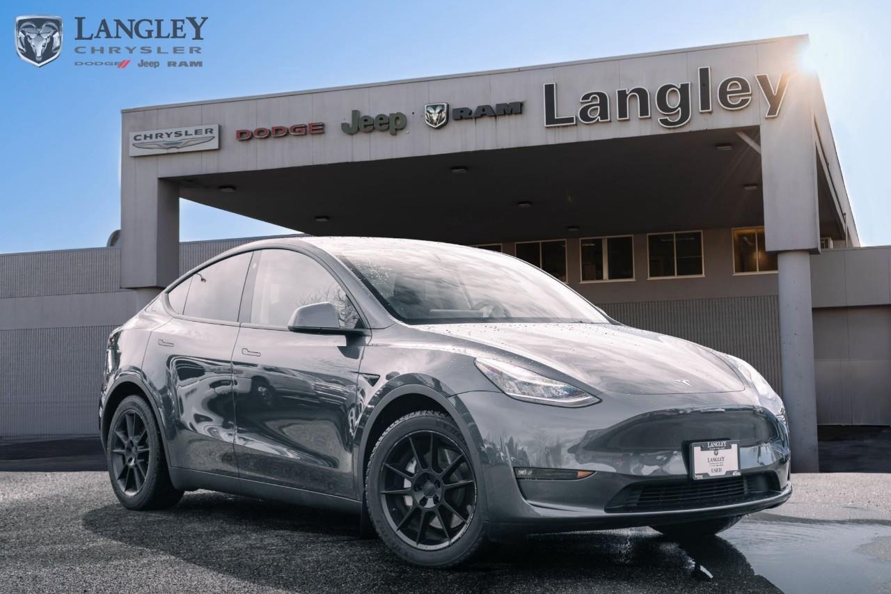 <p><strong>2021 Tesla Model Y Long Range AWD</strong></p><p>The 2021 Tesla Model Y Long Range AWD is a versatile electric crossover that combines impressive range with dual-motor performance. It offers a spacious, tech-heavy cabin and excellent all-weather traction, making it a highly practical choice for families transitioning to electric driving.</p><ul><li><p><strong>Powertrain</strong>: Dual Motor All-Wheel Drive (384 hp and 376 lb-ft torque)</p><p></p></li><li><p><strong>Range</strong>: Up to 525 km of all-electric range on a full charge</p><p></p></li><li><p><strong>Performance</strong>: 0100 km/h in approximately 5.0 seconds</p><p></p></li><li><p><strong>Technology</strong>: 15-inch central touchscreen for all vehicle controls and Autopilot capabilities</p><p></p></li><li><p><strong>Interior</strong>: Panoramic glass roof, premium 15-speaker audio, and heated front and rear seats</p><p></p></li><li><p><strong>Capability</strong>: Up to 1,588 kg (3,500 lbs) towing capacity and 1,926 L of cargo space</p></li></ul><p>Come book a test drive at Langley Chrysler, conveniently located in Langley, British Columbia.</p>

<p>*All prices plus applicable taxes, applicable environmental recovery charges, documentation of $599 and full tank of fuel surcharge of $76 if a full tank is chosen. <br />Other protection items available that are not included in the above price:<br />Tire & Rim Protection and Key fob insurance starting from $599<br />Service contracts (extended warranties) for coverage up to 7 years and 200,000 kms starting from $599<br />Custom vehicle accessory packages, mudflaps and deflectors, tire and rim packages, lift kits, exhaust kits and tonneau covers, canopies and much more that can be added to your payment at time of purchase<br />Undercoating, rust modules, and full protection packages starting from $199<br />Financing Fee of $500 when applicable<br />Flexible life, disability and critical illness insurances to protect portions of or the entire length of vehicle loan</p>