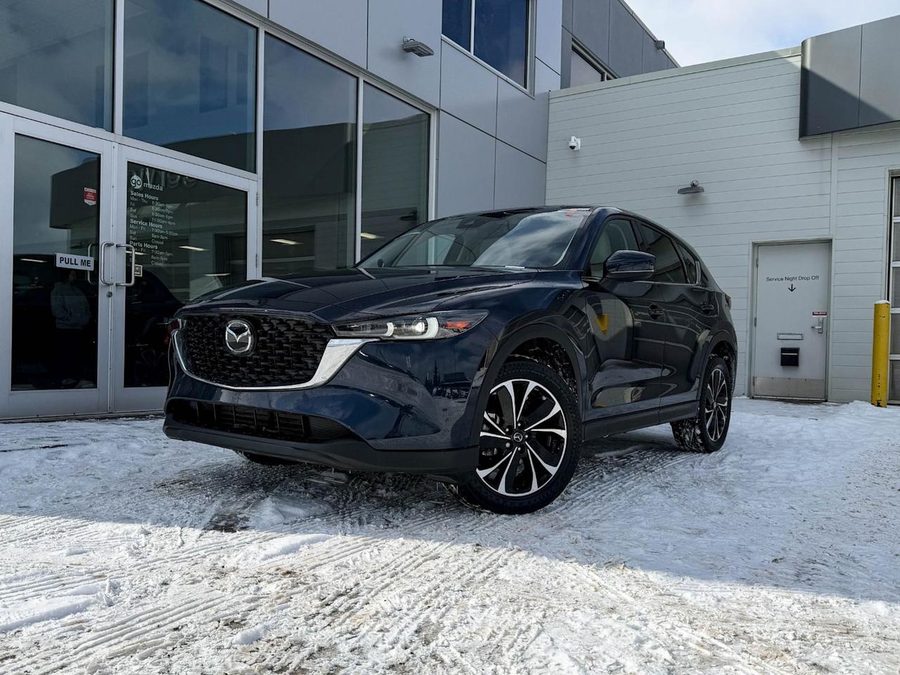 Discover the 2022 Mazda CX-5 GT AWD  a pre-owned SUV that blends performance, luxury, and advanced technology seamlessly. Powered by a 2.5L SKYACTIV-G engine paired with a smooth 6-speed automatic transmission and all-wheel drive, it delivers confident handling in all conditions.Step inside to heated and ventilated leather seats, dual-zone climate control, and a premium Bose sound system paired with a 10.2-inch navigation display, keeping you connected and comfortable on every drive. Safety is paramount with features like lane departure prevention, forward collision mitigation, blind spot warnings, and a rear backup camera.With sleek 19 black alloy wheels, a power liftgate, and advanced driver aids including adaptive headlights and smart keyless entry, this CX-5 GT is a refined and capable companion for your journeys. Visit us today to experience this exceptional SUV firsthand!Go Mazda is an AMVIC licensed business.Clean CarFax