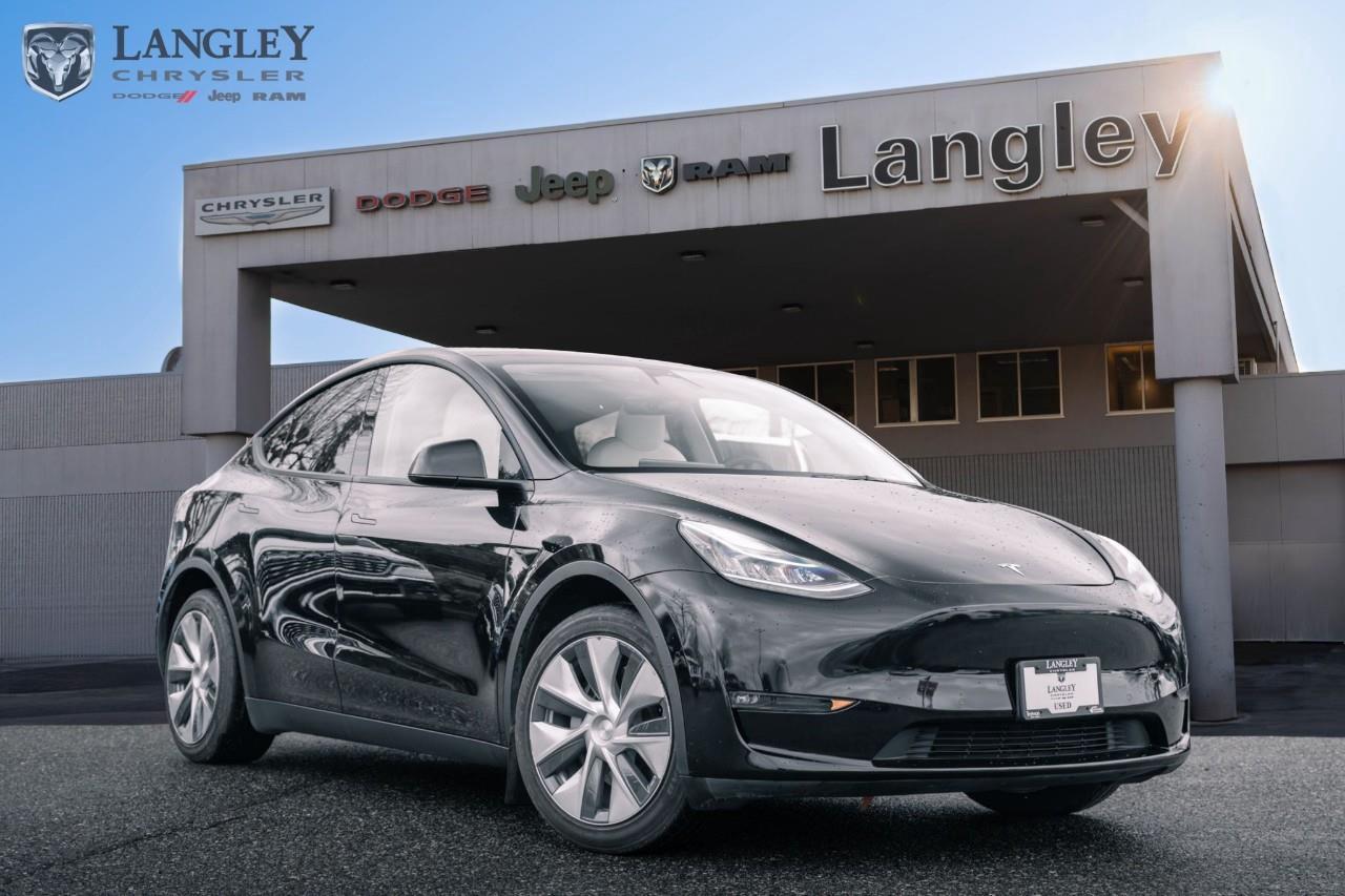 <p><strong>2022 Tesla Model Y Long Range AWD</strong></p><p>The 2022 Tesla Model Y Long Range AWD is an all-electric crossover that blends high-performance driving with advanced technology and versatile interior space. Designed for efficiency and safety, this model offers a dual-motor setup for confident all-weather traction and provides access to a massive charging network for seamless long-distance travel.</p><p></p><ul><li><p><strong>Powertrain</strong>: Dual Motor All-Wheel Drive (425 hp and 475 lb-ft torque)</p><p></p></li><li><p><strong>Range</strong>: Up to 531 km of NRCan-estimated all-electric range</p><p></p></li><li><p><strong>Performance</strong>: 0100 km/h acceleration in approximately 5.0 seconds</p><p></p></li><li><p><strong>Technology</strong>: 15-inch central touchscreen for all vehicle controls and integrated navigation</p><p></p></li><li><p><strong>Interior</strong>: Panoramic glass roof, heated front and rear seats, and a 14-speaker premium audio system</p><p></p></li><li><p><strong>Capability</strong>: Up to 2,158 L of total cargo space and 1,588 kg (3,500 lbs) towing capacity</p><p></p></li></ul><p>Come book a test drive at Langley Chrysler, conveniently located in Langley, British Columbia.</p>

<p>*All prices plus applicable taxes, applicable environmental recovery charges, documentation of $599 and full tank of fuel surcharge of $76 if a full tank is chosen. <br />Other protection items available that are not included in the above price:<br />Tire & Rim Protection and Key fob insurance starting from $599<br />Service contracts (extended warranties) for coverage up to 7 years and 200,000 kms starting from $599<br />Custom vehicle accessory packages, mudflaps and deflectors, tire and rim packages, lift kits, exhaust kits and tonneau covers, canopies and much more that can be added to your payment at time of purchase<br />Undercoating, rust modules, and full protection packages starting from $199<br />Financing Fee of $500 when applicable<br />Flexible life, disability and critical illness insurances to protect portions of or the entire length of vehicle loan</p>