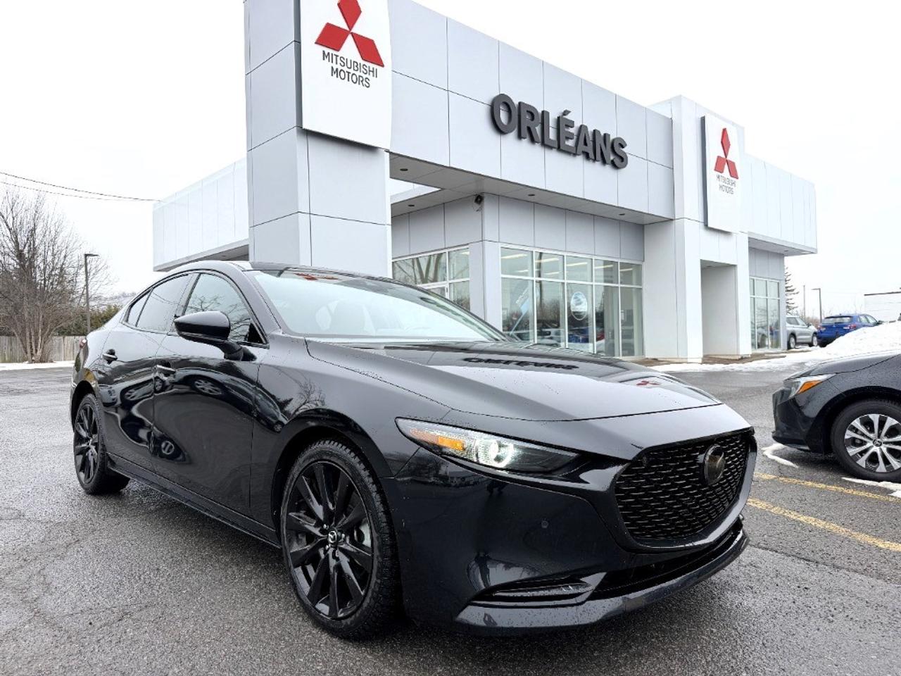 The 2023 Mazda Mazda3 GT w/Turbo in Black is a masterclass in all-wheel drive prowess and responsive handling, specially designed to offer an exhilarating driving experience. This sophisticated sedan combines a dynamic exterior with refined interior comforts, ensuring every journey is a pleasurable one. The Mazda3 GT w/Turbo showcases a captivating design, highlighted by its sleek Black exterior and striking alloy wheels. Once inside, youll find luxurious leather seats and a leather-wrapped steering wheel, complemented by elegant metal-look interior trims. Practical features like heated mirrors and a power sunroof enhance the overall appeal, making each drive both comfortable and stylish. Tech enthusiasts will appreciate the smart device integration and advanced navigation system, making connectivity effortless. Safety and driver assistance are top priorities, with features such as a backup camera, lane assist, and adaptive cruise control included, providing peace of mind on every trip. This sedan is perfect for discerning drivers who value both performance and luxury. Whether its commuting through the city or embarking on a weekend getaway, the Mazda3 GT w/Turbo is engineered to make every journey memorable. Contact us today to learn more about this impressive vehicle and discover the possibilities that await you behind the wheel.