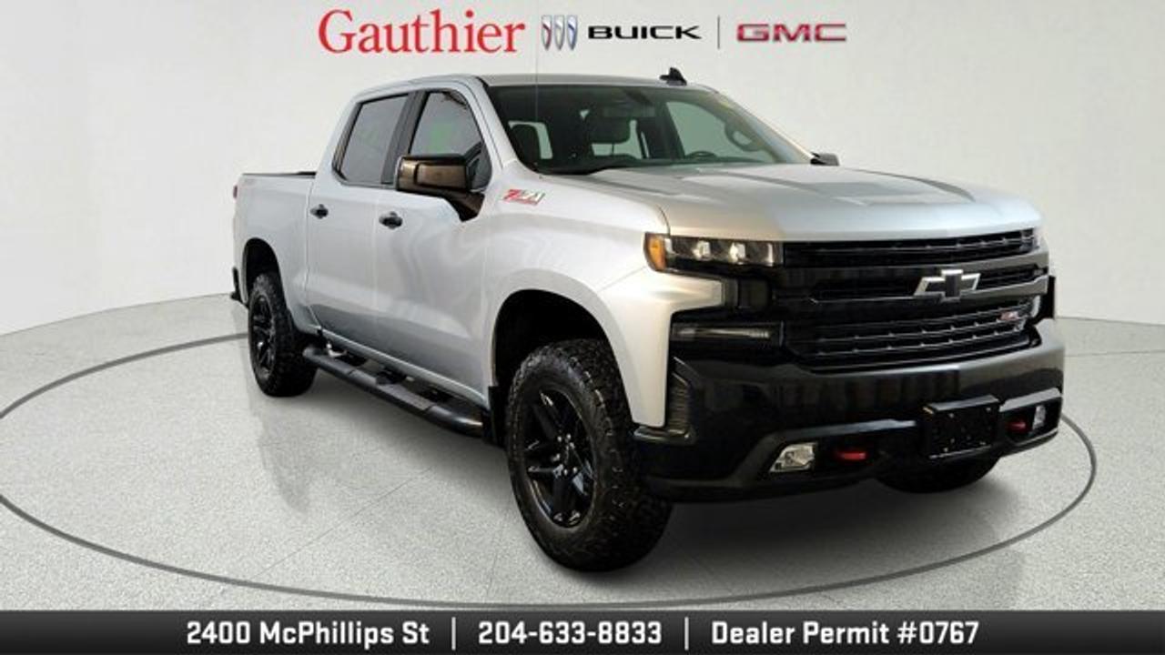 The *2019 Chevrolet Silverado 1500 LT Trail Boss* packs a 5.3-litre V8 engine (355 hp, 383 lb-ft) paired with an 8-speed automatic and a two-speed Autotrac 4WD transfer case for serious power and off-road capability. It rides on a lifted 2-inch suspension with Rancho monotube shocks, 18 Goodyear Wrangler DuraTrac tires, full skid plates, a locking rear differential, and hill-descent control for rugged terrain. Inside, it includes LT-level comforts like an 8 touchscreen with Chevrolet Infotainment 3, Apple CarPlay/Android Auto compatibility, and a trail-focused but functional interior.