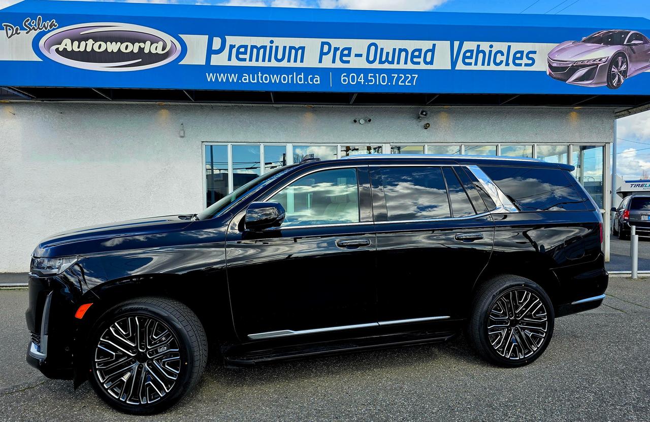 <div><strong>The Ultimate Statement: 2022 Cadillac Escalade Premium Luxury 4WD</strong></div><div>Elevate your presence on the road with this meticulously maintained,&nbsp;<strong>one-owner</strong>,&nbsp;<strong>accident-free</strong>&nbsp;2022 Escalade. Draped in a deep&nbsp;<strong>Black Raven</strong>&nbsp;exterior and riding on stunning&nbsp;<strong>24 Cadillac OEM-style Black and Machined wheels</strong>, this SUV strikes the perfect balance of aggressive styling and sophisticated grace.</div><p>&nbsp;</p><div><strong>Exquisite Interior & Unrivaled Tech</strong><br>Step inside to a sanctuary of&nbsp;<strong>Parchment Mulan Leather</strong>&nbsp;with Jet Black accents. The cabin is anchored by a massive&nbsp;<strong>38-inch curved OLED display</strong>&nbsp;and an immersive&nbsp;<strong>19-speaker AKG Studio sound system</strong>. Every journey is enhanced by the&nbsp;<strong>Driver Assist Tech Package</strong>, featuring&nbsp;<strong>Soft-Close doors</strong>,&nbsp;<strong>Air Ride Adaptive Suspension</strong>, and&nbsp;<strong>Super Cruise&trade;</strong>&mdash;the industry&rsquo;s first true hands-free driving technology.</div><p>&nbsp;</p><div><strong>Performance & Capability</strong><br>Beneath the hood lies the heart of a titan, paired with the&nbsp;<strong>Performance Package</strong>. Whether you&rsquo;re towing or touring, you&rsquo;re backed by:</div><ul><li><strong>Magnetic Ride Control</strong>&nbsp;for a glass-smooth finish.</li><li>Electronic Limited-Slip Differential & Integrated Trailer Brake Controller.</li><li><strong>Hitch Guidance with Hitch View</strong>&nbsp;for effortless hauling.</li></ul><div><strong>Luxury at Every Touchpoint</strong></div><ul><li><strong>Comfort:</strong>&nbsp;Heated and Ventilated 12-way power seats, Heated Steering Wheel, and Tri-Zone Climate Control.</li><li><strong>Convenience:</strong>&nbsp;Panoramic Power Sunroof, Rear Camera Mirror, and a Hands-Free Power Liftgate.</li><li><strong>Protection:</strong>&nbsp;Full All-Weather Floor and Cargo Liner Package.</li></ul><p>Cadillac Build sheet :&nbsp;</p><p>EXTERIOR / EXTERIEUR: BLACK RAVEN</p><p>INTERIOR / INTERIEUR:</p><p>PARCHMENT/JET BLACK ACCENTS</p><p>1SB PACKAGE</p><p>DRIVER ASSIST TECH PACKAGE:</p><p>&bull; SILL PLATES, ILLUMINATED</p><p>&bull; DOORS, FRONT AND REAR, SOFT</p><p>&nbsp; CLOSE/CINCHING</p><p>&bull; AIR RIDE ADAPTIVE SUSPENSION</p><p>SUPER CRUISE(TM)</p><p>FLOOR LINER PACKAGE:</p><p>&bull; ALL-WEATHER INTEGRATED CARGO</p><p>&nbsp; LINER</p><p>&bull; ALL-WEATHER FLOOR LINER PKG</p><p>ENGINE BLOCK HEATER</p><p>&nbsp;</p><p>PERFORMANCE</p><p>&bull; AUTOMATIC STOP/START</p><p>&bull; INDEPENDENT REAR SUSPENSION</p><p>&bull; PERFORMANCE PACKAGE- TRAILER SIDE BLIND ZONE</p><p>&nbsp; ALERT- ELECTRONIC LIMITED-SLIP</p><p>&nbsp; DIFFERENTIAL- INTEGRATED TRAILER BRAKE</p><p>&nbsp; CONTROLLER- MAGNETIC RIDE CONTROL- HITCH GUIDANCE W/ HITCH VIEW</p><p>LUXURY & CONVENIENCE</p><p>&bull; AKG STUDIO 19-SPEAKER SYSTEM</p><p>&bull; SIRIUSXM RADIO CAPABLE,</p><p>&nbsp; ALL ACCESS TRIAL W/</p><p>&nbsp; SUBSCRIPTION SOLD SEPARATELY</p><p>&bull; CADILLAC USER EXPERIENCE W/</p><p>&nbsp; 16.9 DIAG. OLED INFOTAINMENT</p><p>&nbsp; SCREEN, EMBEDDED NAVIGATION,</p><p>&nbsp; VOICE RECOGNITION, WIRELESS</p><p>&nbsp; APPLE CARPLAY & WIRELESS</p><p>&nbsp; ANDROID AUTO CAPABILITY</p><p>&bull; 14.2 DIAG. OLED</p><p>&nbsp; RECONFIG. CLUSTER DISPLAY</p><p>&bull; 7.2 DIAG. OLED CONTROL PANEL</p><p>&bull; HEAD-UP DISPLAY</p><p>&bull; WIRELESS DEVICE CHARGING</p><p>&bull; PASSIVE ENTRY & KEYLESS START</p><p>&bull; ADAPTIVE REMOTE START</p><p>&bull; HEATED STEERING WHEEL</p><p>&bull; SEAT ADJUSTER, DRIVER & FRONT</p><p>&nbsp; PASSENGER POWER 12-WAY</p><p>&bull; HEATED & VENTED FRONT SEATS</p><p>&bull; 2ND ROW BUCKET, POWER</p><p>&nbsp;RELEASE, HEATED OUTBOARD SEATS</p><p>&bull; SEATS, 3RD ROW 60/40 SPLIT</p><p>&nbsp; BENCH, POWER FOLD</p><p>&bull; MULAN LEATHER SEATING</p><p>&nbsp; SURFACES</p><p>&bull; MEMORY SETTINGS DRIVER SEAT</p><p>&nbsp; & OUTSIDE MIRRORS,&nbsp;&nbsp; TILT/</p><p>&nbsp; TELESCOPIC STEERING COLUMN</p><p>&bull; POWER OUTLET, 110-VOLT</p><p>&bull; TRI ZONE AUTO CLIMATE CONTROL</p><p>&bull; REAR CAMERA MIRROR</p><p>&bull; SELECTABLE INTERIOR LIGHTING</p><p>&bull; CONVERSATION ENHANCEMENT</p><p>&bull; RAINSENSE FRONT WIPERS</p><p>&bull; DOOR HANDLES, ILLUMINATED</p><p>&bull; SUNROOF, POWER PANORAMIC</p><p>&bull; ASSIST STEPS</p><p>&bull; HANDS FREE POWER LIFTGATE</p><p>&bull; INTELLIBEAM, AUTO HIGH BEAM</p><p>&bull; HEADLAMPS / TAIL LAMPS, LED</p><p>&bull; WHEELS, 22 14-SPOKE POLISHED</p><p>SAFETY & SECURITY</p><p>&bull; HD SURROUND VISION</p><p>&bull; REAR CROSS TRAFFIC ALERT</p><p>&bull; SAFETY ALERT SEAT</p><p>&bull; FORWARD COLLISION ALERT</p><p>&bull; FRONT PEDESTRIAN BRAKING</p><p>&bull; REAR PEDESTRIAN ALERT</p><p>&bull; ENHANCED AUTO PARKING ASSIST</p><p>&bull; TEEN DRIVER</p><p>&bull; BRAKE PAD MONITOR</p><p>&bull; THEFT-DETERRENT PACKAGE</p><p>&bull; ADAPTIVE CRUISE CONTROL</p><p>&bull; ENHANCED AUTOMATIC EMERGENCY</p><p>&nbsp; BRAKING</p><p>&bull; AUTO SEAT BELT</p><p>&nbsp; TIGHTENING</p><p>&bull; WHEEL LOCK</p><p>&nbsp;</p><p>&nbsp;</p><div>This is more than a vehicle; it&rsquo;s a private jet for the pavement. Experience the pinnacle of American luxury.</div><p>&nbsp;</p><p>&nbsp;</p><p>Starting Nov 15 2025 Autoworld Will Not Be Charging Any Documentation fees</p><p>&nbsp;</p><p>All Prices Are Plus Applicable Sales Taxes</p><p>&nbsp;</p><p>Please Contact Dealer For Warranty Details*** Extended Warranty Available.</p><p>&nbsp;</p><p>For More Details Visit http://Autoworld.ca/</p><p>&nbsp;</p><p>Contact @Autoworld 604-510-7227</p><p>19987 Fraser Highway</p><p>Langley BC</p><p>V3A 4E2</p><p>&nbsp;</p><p>VSA : 31259</p><p>&nbsp;</p><p>&nbsp;</p>