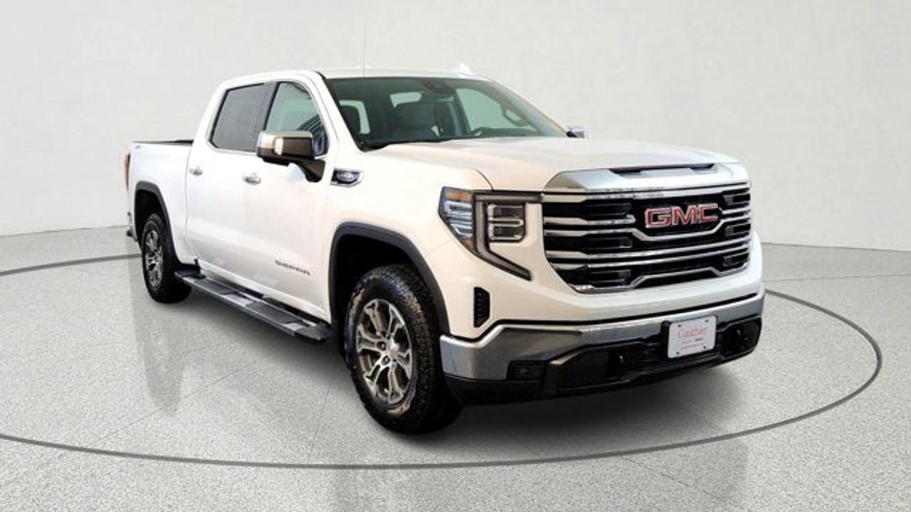 The 2026 GMC Sierra 1500 SLT is a refined full-size pickup that blends strong capability with upscale features, including a standard 5.3L EcoTec3 V8 engine, and impressive towing capacity of up to about 11,200 lbs when properly equipped. It stands out with chrome exterior accents and a comfortable interior featuring leather-appointed seating, power-adjustable front seats with lumbar support, heated front seats and steering wheel, and advanced trailering tools like an integrated brake controller and Hitch View camera. Technology is also a highlight, with a 10-inch touchscreen infotainment system offering wireless Apple CarPlay and Android Auto, Wi-Fi capability and a suite of GMC Pro Safety driver-assistance features for added confidence on the road. But its just as capable off-road thanks to the X31 Offroad package, which includes off-road suspension, Hill Descent Control, skid plates and a heavy-duty air filter.
