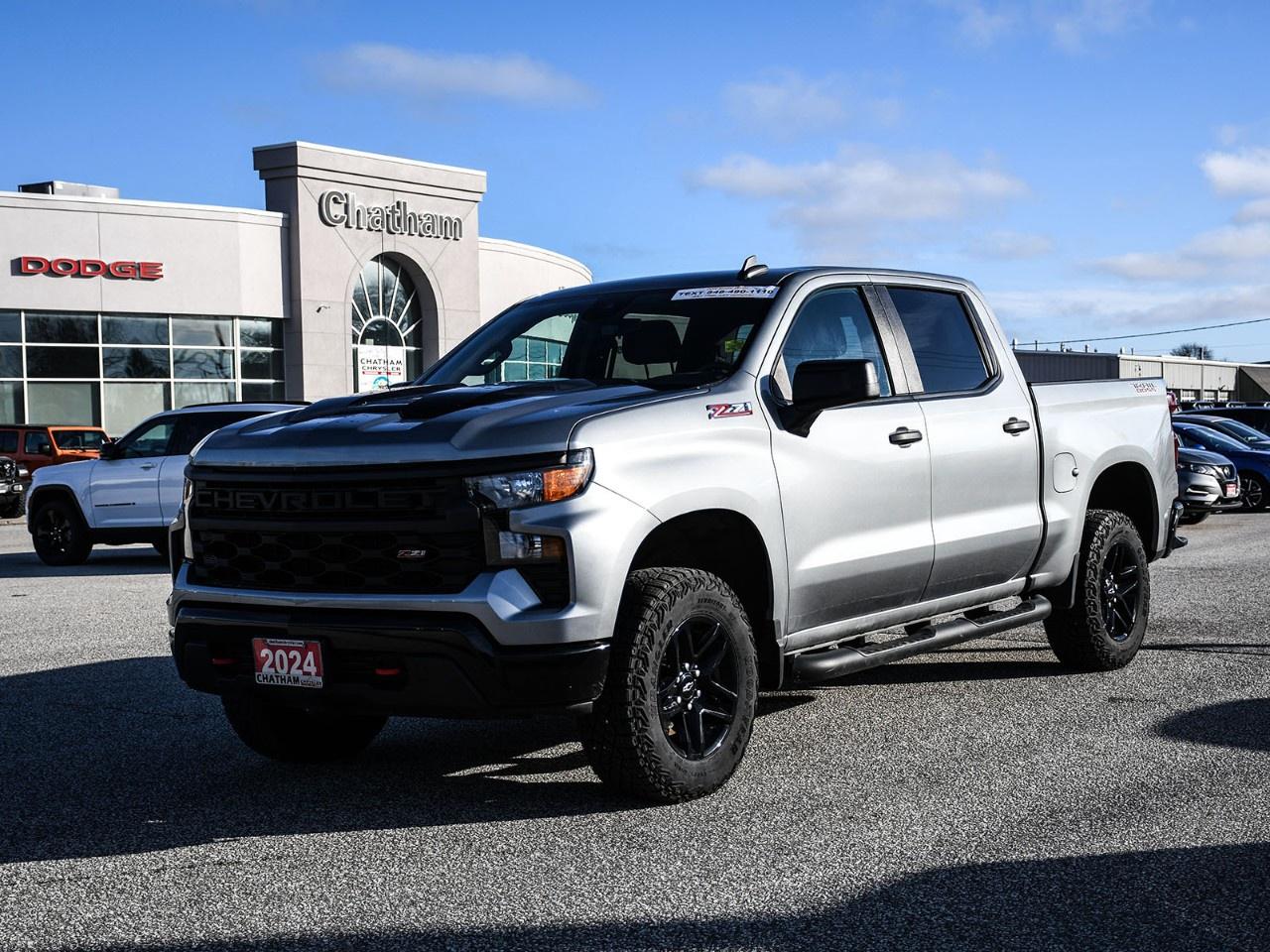 2024 Chevrolet Silverado 1500 4D Crew Cab Custom Trail Boss Sterling Gray Metallic 10-Speed Automatic, 4WD, Jet Black Cloth, 10-Way Power Driver Seat w/Lumbar, 120-Volt Bed Mounted Power Outlet, 120-Volt Interior Power Outlet, 170 Amp Alternator, 220 Amp Alternator, 3.5''' Monochromatic Display Driver Info Centre, 4-Wheel Disc Brakes, 4''' Black Round Assist Steps (LPO), 6-Speaker Audio System, ABS brakes, Air Conditioning, Alloy wheels, Apple CarPlay/Android Auto, Auto High-beam Headlights, Auto-Locking Rear Differential, Automatic Emergency Braking, Auxiliary External Transmission Oil Cooler, Bluetooth® For Phone, Brake assist, Chevrolet Connected Access Capable, Chevytec Spray-On Black Bedliner, Colour-Keyed Carpeting Floor Covering, Custom Convenience Package, Deep-Tinted Glass, Delay-off headlights, Dual Exhaust w/Polished Outlets, Dual Rear USB Ports (Charge Only), Electric Rear-Window Defogger, Electrical Steering Column Lock, Electronic Cruise Control, Electronic Stability Control, EZ Lift Power Lock & Release Tailgate, Following Distance Indicator, Forward Collision Alert, Front Pedestrian Braking, Front Rubberized Vinyl Floor Mats, Fully automatic headlights, HD Rear Vision Camera, Heavy-Duty Air Filter, Hill Descent Control, Hitch Guidance, Illuminated entry, Integrated Trailer Brake Controller, Lane Keep Assist w/Lane Departure Warning, LED Cargo Area Lighting, Manual Tilt Wheel Steering Column, OnStar & Chevrolet Connected Services Capable, Performance Red Recovery Hooks, Power driver seat, Power Front Windows w/Driver Express Up/Down, Power Front Windows w/Passenger Express Down, Power Rear Windows w/Express Down, Preferred Equipment Group 2CX, Premium audio system: Chevrolet Infotainment 3, Radio: Chevrolet Infotainment 3 System, Rear 60/40 Folding Bench Seat (Folds Up), Rear Rubberized-Vinyl Floor Mats, Remote Keyless Entry, Remote keyless entry, Remote Vehicle Starter System, Security system, SiriusXM, Standard Tailgate, Suspension Package, Theft Deterrent System (Unauthorized Entry), Traction control, Trailering Package, Wheels: 18''' x 8.5''' Black Painted Aluminum, Wi-Fi Hot Spot Capable. 4WD EcoTec3 5.3L V8 10-Speed Automatic<br /><br /><br />Here at Chatham Chrysler, our Financial Services Department is dedicated to offering the service that you deserve. We are experienced with all levels of credit and are looking forward to sitting down with you. Chatham Chrysler Proudly serves customers from London, Ridgetown, Thamesville, Wallaceburg, Chatham, Tilbury, Essex, LaSalle, Amherstburg and Windsor with no distance being ever too far! At Chatham Chrysler, WE CAN DO IT!