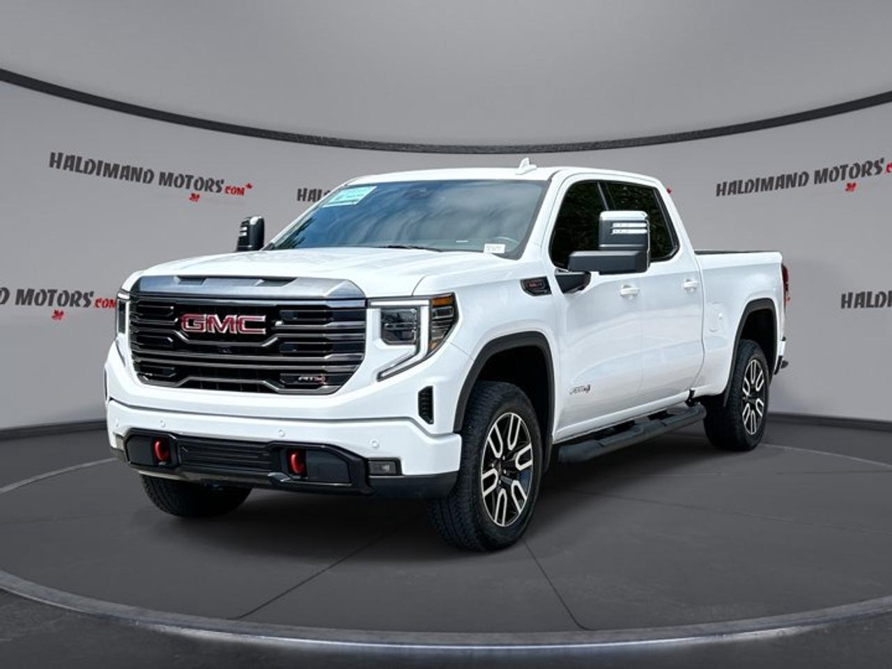 // ACCIDENT FREE!! //<br />// SINGLE OWNER! //<br /><br />Built for drivers who want real V8 power, off-road confidence, and premium comfort, this 2024 GMC Sierra 1500 AT4 Crew Cab 4WD is ready for work and weekend travel alike. Sold by Haldimand Motors Ltd. in Cayuga, this used truck is finished in White with a Black interior.<br /><br />With 43,200 km, automatic transmission, and a 6.2-litre gas engine, this 2024 GMC Sierra 1500 AT4 Crew Cab 4WD blends strong capability with upscale features. It has had one owner and no reported accidents, making it an appealing choice for drivers who want a well-kept full-size pickup.<br /><br />FEATURES OF THE Sierra 1500 AT4 Crew Cab 4WD | One owner | No accidents | Ventilated Seats | 360 Camera<br />   6.2-litre V8 power for confident hauling<br />   Ventilated front seats add summer comfort<br />   360-degree camera helps tight manoeuvres<br />   Four-wheel drive supports off-road traction<br /><br />TRUCK FEATURES<br />   Tows up to 4,036 kg confidently<br />   Trailer hitch ready for towing duties<br />   Rear tow hook adds recovery support<br />   Off-road tires suit rougher terrain<br /><br />ADVANCED SAFETY FEATURES<br />   Blind spot monitor aids lane changes<br />   Lane departure warning adds extra awareness<br />   360-degree camera improves close-range visibility<br />   Anti-lock brakes support controlled stopping<br /><br />PERFORMANCE AND EFFICIENCY<br />   6.2-litre gas V8 delivers strong output<br />   Automatic transmission shifts smoothly under load<br />   Four-wheel drive boosts all-surface traction<br />   Limited slip differential aids grip<br /><br />COMFORT AND CONVENIENCE<br />   Ventilated front seats help hot days<br />   Heated front and rear seats comfort<br />   Heated steering wheel warms winter drives<br />   Dual-zone climate control keeps balance<br /><br />TECHNONOLGY AND CONNECTIVITY<br />   Apple CarPlay connects favourite smartphone apps<br />   Android Auto adds easy phone integration<br />   Navigation system guides each trip clearly<br />   Bluetooth, Wi-Fi hotspot, HD Radio included<br /><br />CARGO SPACE<br />   Crew Cab adds roomy passenger space<br />   Rear trunk access supports loading ease<br />   Four full doors improve daily practicality<br />   Power windows add simple cabin convenience<br /><br />AWARDS & RECOGNITIONS<br />   2024 Best Buy Award, Consumer Guide Automotive<br /><br />WHAT OTHER OWNERS LIKE<br />   Strong V8 power for towing confidence<br />   Comfortable ride for a full-size truck<br />   User-friendly tech and screen layout<br />   Spacious cabin for family and gear<br /><br />This 2024 GMC Sierra 1500 AT4 Crew Cab 4WD offers the rugged style and everyday usability many truck buyers want. The AT4 trim is known for blending premium comfort with true pickup toughness, and this example adds sought-after features like ventilated front seats, adaptive cruise control, and a 360-degree camera.<br /><br />The White exterior gives this 2024 GMC Sierra 1500 AT4 Crew Cab 4WD a clean, upscale look, while black interior trim keeps the cabin timeless and easy to live with. LED headlamps, fog lights, tinted windows, heated mirrors, retractable mirrors, and a sunroof add convenience and visual appeal.<br /><br />Inside, this 2024 GMC Sierra 1500 AT4 Crew Cab 4WD is designed to keep long drives comfortable. You get power front seats, memory settings, driver and passenger lumbar support, automatic climate control, rear window defroster, push button start, and steering wheel audio controls for easy command on the move.<br /><br />Technology is a major strength in this 2024 GMC Sierra 1500 AT4 Crew Cab 4WD. The navigation system, satellite radio, HD Radio, Bluetooth integration, Apple CarPlay, Android Auto, and Wi-Fi hotspot make it easy to stay informed, entertained, and connected whether youre commuting, towing, or heading out of town.<br /><br />Confidence comes from a smart list of driver-assist features in this 2024 GMC Sierra 1500 AT4 Crew Cab 4WD. Along with the backup camera and 360-degree camera, it includes adaptive cruise control, blind spot monitor, tire pressure monitoring, stability control, and a full set of airbags for added peace of mind.<br /><br />For truck shoppers in Cayuga looking for a powerful, well-equipped, accident-free pickup, this 2024 GMC Sierra 1500 AT4 Crew Cab 4WD stands out. Its one-owner history, V8 performance, premium comfort, and real towing ability make it a smart choice at Haldimand Motors Ltd.<br /><br />This 2024 GMC Sierra 1500 AT4 Crew Cab 4WD | One owner | No accidents | Ventilated Seats | 360 Cameras VIN is: 3GTUUEELXRG397070.<br /><br />WHY CHOOSE US? <br /><br />Honest & Transparent Buying Experience: Weve been a trusted name in business since 1984.<br /><br />STRAIGHTFORWARD PRICING:<br />Our Advertised Price Includes:<br />>>Safety Certification (No separate fee!)<br />>>30-Day 100% Mechanical Warranty<br />>>FREE Carfax History Report.<br />>>No upcharge for paying cash.<br />(Prices Exclude HST and Licensing Fees only.)<br /><br />>>Browse 300+ vehicles all in ONE LOCATION<br /><br />EASY FINANCING: Great rates & open loans<br /><br />WE BUY CARS: Get Top Dollar for your trade-in, or sell us your vehicle for CASH! Even if you dont buy from us!<br /><br />STOP BY TODAY<br />Treat yourself - stop by Haldimand Motors Ltd. located at 42 Talbot St E, Cayuga, ON N0A 1E0 to make this car yours today!<br /><br />https://www.haldimandmotors.com/used/stock-460243.html