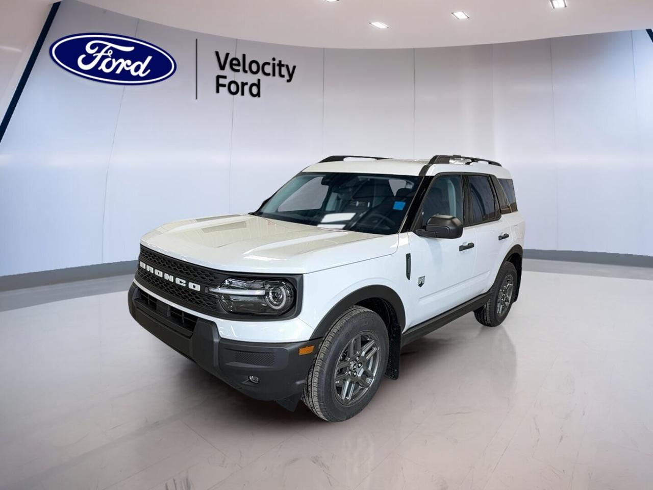 Built for Canadian weather and ready for daily life in Moose Jaw, this brand new 2026 Ford Bronco Sport Big Bend 4x4 delivers smart utility, sure-footed traction, and easy comfort in one well-sized SUV. Finished in White with a Grey interior, this four-door Bronco Sport Big Bend 4x4 pairs a 1.5-litre unleaded engine with an 8-speed automatic transmission for confident, efficient driving.

At Velocity Ford, this new SUV stands out with the features drivers use most every day. You get four-wheel drive for added control, heated front seats for cold mornings, automatic climate control for steady cabin comfort, and a backup camera to help in tight spaces. Its upright design also helps with visibility, easy entry, and practical cargo access.

FEATURES OF THE Bronco Sport Big Bend 4x4

»» Brand new SUV with four-wheel drive
»» 1.5-litre unleaded engine with automatic
»» White exterior with Grey interior
»» Four doors and rear trunk access

ADVANCED SAFETY FEATURES

»» Anti-lock brakes help maintain steering control
»» Stability control supports confident road handling
»» Blind spot monitor adds lane awareness
»» Lane departure warning helps avoid drift

PERFORMANCE AND EFFICIENCY

»» 1.5-litre engine balances power and economy
»» Eight-speed automatic supports smooth acceleration
»» Four-wheel drive boosts traction year-round
»» Cruise control helps on longer trips

COMFORT AND CONVENIENCE

»» Heated front seats add winter comfort
»» Automatic climate control keeps cabin pleasant
»» Power driver seat includes lumbar support
»» Push button start adds everyday ease

TECHNONOLGY AND CONNECTIVITY

»» Bluetooth integration supports hands-free calling
»» WiFi hotspot keeps devices connected
»» Satellite radio expands entertainment choices
»» Steering wheel audio controls simplify use

CARGO SPACE

»» Rear trunk access helps daily loading
»» Four-door layout improves passenger entry
»» Flexible cabin suits errands and travel
»» Useful space for gear and groceries

AWARDS & RECOGNITIONS

The Ford Bronco Sport family has earned strong praise in North America for its utility, smart design, and owner satisfaction. Awards can vary by model year and exact configuration. This 2026 Ford Bronco Sport Big Bend 4x4 is best appreciated for its practical capability, everyday usability, and confidence in changing road conditions.

WHAT OTHER OWNERS LIKE

»» Easy-to-drive size with useful versatility
»» Winter-ready traction from four-wheel drive
»» Comfortable seating and simple controls
»» Handy cargo area for active lifestyles

This new 2026 Ford Bronco Sport Big Bend 4x4 also includes many sought-after features that add value to every drive. Highlights include power steering, power windows, electric mirrors, heated mirrors, tinted windows, front air conditioning, automatic headlights, LED headlamps, tire pressure monitoring, child safety locks, driver and passenger airbags, side impact airbags, head side airbags, a passenger airbag sensor, automatic door locks, and a rear window defroster.

The cabin is designed for simple, useful comfort. An adjustable steering wheel helps you find the right driving position, while illuminated vanity mirrors for both front occupants add convenience. The clean layout keeps key controls close at hand, and the automatic transmission makes city traffic and highway travel feel relaxed and smooth.

For drivers shopping for a compact SUV with true everyday value, this brand new Ford offers a smart mix of traction, comfort, and modern safety. It is practical without feeling basic, capable without being oversized, and well-equipped for commuting, family use, and weekend plans around Saskatchewan.

This 2026 Ford Bronco Sport Big Bend 4x4s VIN is: 3FMCR9BN7TRE19866.