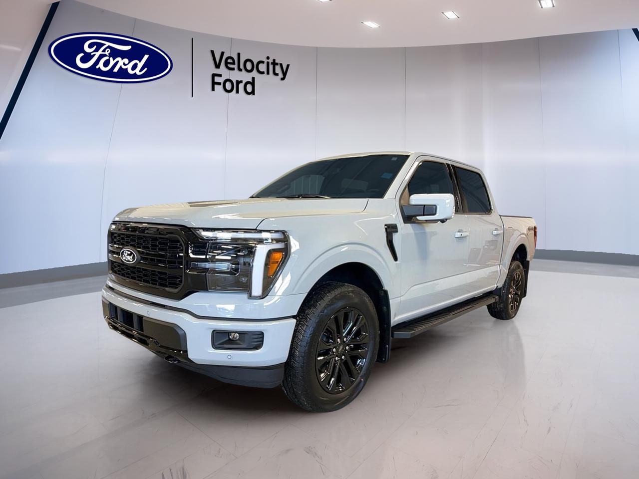 Get ready for full-size truck capability with the brand new 2026 Ford F-150 LARIAT 4WD SuperCrew 5.5 Box at Velocity Ford in Moose Jaw. Finished in White with a Black interior, this four-door pickup blends strong V6 power, refined comfort, and smart everyday utility for work, towing, and family travel.

This brand new 2026 Ford F-150 LARIAT 4WD SuperCrew 5.5 Box is powered by a 3.5-litre unleaded engine paired with an automatic transmission. Its four-wheel drive system adds confidence in changing Prairie weather, while the SuperCrew cab and 5.5-foot box give you the space and flexibility a modern truck should deliver.

FEATURES OF THE F-150 LARIAT 4WD SuperCrew 5.5 Box
»» White exterior with Black interior
»» Four-door SuperCrew cabin adds daily practicality
»» Automatic transmission with dual shift mode
»» 3.5-litre unleaded engine with four-wheel drive

TRUCK FEATURES
»» Tows up to 4,671 kg confidently
»» Rear tow hook supports truck utility
»» Side steps ease cabin entry
»» Off-road tires add extra traction

ADVANCED SAFETY FEATURES
»» Anti-lock brakes help controlled emergency stops
»» Stability control supports secure road manners
»» Backup camera helps with reversing
»» Blind spot monitor boosts lane awareness

PERFORMANCE AND EFFICIENCY
»» 3.5-litre engine delivers strong usable power
»» Automatic transmission provides smooth shifting
»» Four-wheel drive improves traction year-round
»» Cruise control supports relaxed highway travel

COMFORT AND CONVENIENCE
»» Heated front seats add winter comfort
»» Dual-zone climate control helps everyone
»» Remote starter adds everyday convenience
»» Power windows and power steering

TECHNONOLGY AND CONNECTIVITY
»» Navigation system helps guide every trip
»» Bluetooth integration supports hands-free calling
»» Wi-Fi hotspot keeps devices connected
»» Satellite radio expands entertainment choices

CARGO SPACE
»» 5.5-foot box supports daily hauling
»» Rear trunk access aids loading ease
»» Spare tire adds peace of mind
»» SuperCrew cabin offers flexible storage space

WHAT OTHER OWNERS LIKE
»» Strong towing ability for trailers
»» Comfortable ride for daily driving
»» User-friendly tech for easy operation
»» Spacious cabin for passengers and gear

The 2026 Ford F-150 LARIAT 4WD SuperCrew 5.5 Box is built for drivers who need real truck strength without giving up comfort and convenience. Heated mirrors, electric mirrors, retractable mirrors, tinted windows, fog lights, LED headlamps, chrome wheels, and turn signal mirrors add both function and style to this capable pickup.

Inside, this 2026 Ford F-150 LARIAT 4WD SuperCrew 5.5 Box is equipped to make long days easier. You get front air conditioning, automatic climate control, steering wheel audio controls, adjustable pedals, an adjustable steering wheel, memory seats, memory mirrors, lumbar support for both front occupants, push button start, and an auto-dimming rearview mirror.

Safety and driver support are also well covered in this 2026 Ford F-150 LARIAT 4WD SuperCrew 5.5 Box. It includes driver and passenger airbags, side impact airbags, head side airbags, child safety locks, lane departure warning, tire pressure monitoring, automatic headlights, rear window defroster, and automatic door locks. This truck is ready to support daily driving, weekend towing, and year-round use in Saskatchewan.

This 2026 Ford F-150 LARIAT 4WD SuperCrew 5.5 Boxs VIN is: 1FTFW5L87TKD55814.
