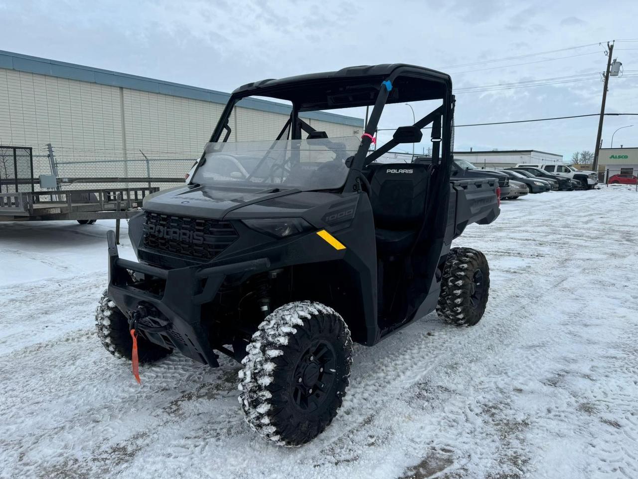 <p><strong>Tackle Any Job with the 2024 Polaris Ranger 1000 Premium</strong></p><p>The 2024 Polaris Ranger 1000 Premium is built to dominate tough tasks and rugged adventures with ease. Equipped with a powerful and efficient 999cc ProStar engine, this side-by-side delivers exceptional torque, smooth handling, and unparalleled durability for both work and play. Whether you&rsquo;re conquering challenging trails or handling demanding jobs, the Ranger 1000 Premium is designed to perform.</p><p>&nbsp;</p><p>With 12 inches of ground clearance, independent rear suspension, and an advanced on-demand all-wheel drive system, the Ranger 1000 Premium ensures a smooth, stable ride over rough terrain. Its impressive towing capacity of up to 2,500 pounds and a 1,000-pound cargo box make it the perfect companion for hauling gear, supplies, or equipment.</p><p>&nbsp;</p><p><strong>Built for Comfort and Versatility</strong></p><p>The 2024 Polaris Ranger 1000 Premium features a spacious and ergonomic cab to keep you comfortable, even during long hours on the job or trail. Adjustable seating, user-friendly controls, and abundant storage for tools and gear combine practicality with premium comfort. Whether you&rsquo;re working hard or exploring the great outdoors, this side-by-side is ready for any challenge.</p><p>&nbsp;</p><p><strong>Flexible Financing & Nationwide Delivery</strong></p><p>Make the 2024 Polaris Ranger 1000 Premium yours today with our flexible financing options that fit your budget. Plus, take advantage of our fast, nationwide delivery for ultimate convenience. Don&rsquo;t wait to experience the power and reliability of the Ranger 1000 Premium&mdash;contact us now to learn more or schedule your test ride!</p>