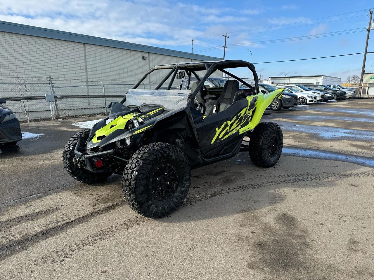 <p data-start=0 data-end=361>The 2021 Yamaha YXZ1000R Special Edition is built for pure performance, delivering adrenaline-pumping thrills on the most challenging terrain. Powered by a high-revving 998cc DOHC inline-triple engine, this side-by-side delivers instant acceleration and exceptional responsiveness, making it the ultimate machine for dunes, trails, and high-speed desert runs.</p><p data-start=0 data-end=361>&nbsp;</p><p data-start=363 data-end=751>Equipped with Yamaha&rsquo;s industry-exclusive sequential 5-speed manual transmission with a hydraulic clutch, the YXZ1000R SE provides precise control over power delivery, allowing you to dominate tight corners and technical terrain with confidence. The FOX 2.5 Podium RC2 shocks, adjustable suspension, and 14 inches of ground clearance ensure a smooth ride even over the roughest terrain.</p><p data-start=363 data-end=751>&nbsp;</p><p data-start=753 data-end=1106>The Special Edition package includes 29-inch Maxxis Carnivore tires on 14-inch beadlock wheels for superior traction and durability, along with a factory-installed Warn winch for added versatility. Inside, the cockpit features premium bolstered seats, a sport steering wheel, and Yamaha&rsquo;s electric power steering (EPS) for maximum control and comfort.</p><p data-start=753 data-end=1106>&nbsp;</p><p data-start=0 data-end=321>&nbsp;</p><p data-start=1108 data-end=1328 data-is-last-node= data-is-only-node=>Designed for those who crave high-speed performance and precision handling, the 2021 Yamaha YXZ1000R Special Edition is ready to take on any adventure. Contact us today for financing options and fast nationwide delivery!</p>