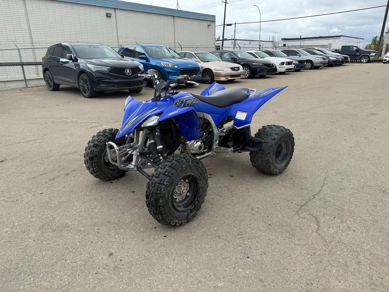 <p data-start=190 data-end=507>Precision-built for riders who demand top-tier performance, the 2022 Yamaha YFZ450R is a championship-winning sport ATV designed to dominate both the track and the trail. Whether you&rsquo;re chasing podiums or carving up open terrain, this machine delivers race-ready power, control, and agility straight from the factory.</p><p data-start=190 data-end=507>&nbsp;</p><p data-start=509 data-end=849>At its heart is a high-performance 449cc fuel-injected, liquid-cooled engine with titanium five-valve technology&mdash;tuned for explosive throttle response and aggressive acceleration across the powerband. Paired with a close-ratio five-speed transmission and lightweight forged piston, the YFZ450R is built for serious speed and responsiveness.</p><p data-start=509 data-end=849>&nbsp;</p><p data-start=851 data-end=1192>Engineered with a motocross-inspired chassis, this sport quad features long-travel adjustable suspension, wide-set A-arms, and a low center of gravity for razor-sharp handling and stability through tight corners and jumps. The aluminum/steel hybrid frame balances strength and weight for unmatched durability without sacrificing performance.</p><p data-start=851 data-end=1192>&nbsp;</p><p data-start=1194 data-end=1384>A race-style seat, adjustable handlebars, and bodywork designed for easy rider movement give you full control when pushing limits&mdash;whether youre at the track or tearing through open terrain.</p><p data-start=1194 data-end=1384>&nbsp;</p><p data-start=194 data-end=495>&nbsp;</p><p data-start=1386 data-end=1585>If you&rsquo;re ready to experience the thrill of pure sport performance, the 2022 Yamaha YFZ450R is waiting. Contact us today for flexible financing and nationwide delivery!</p>