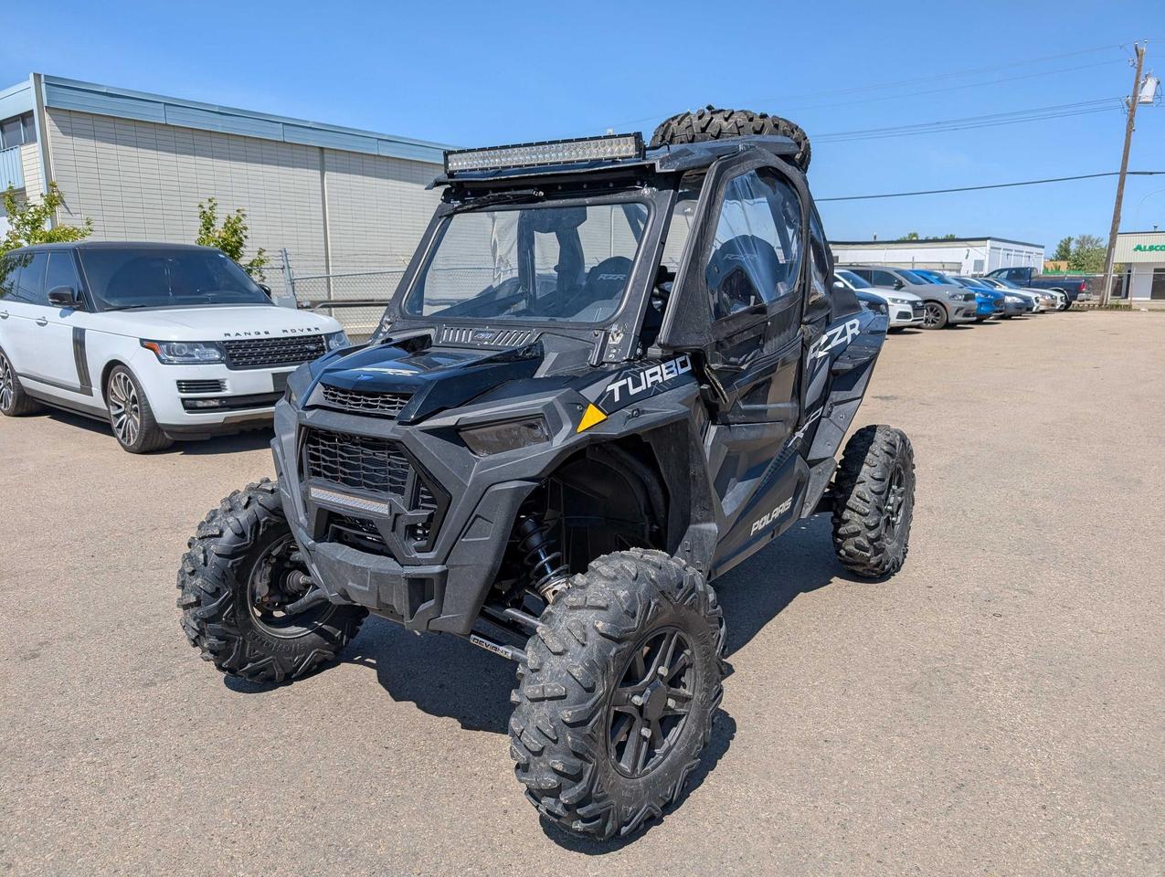 <p data-start=138 data-end=511>The 2020 Polaris RZR XP Turbo is engineered for riders who crave speed, strength, and control in the most demanding off-road environments. Powered by a 168 HP Turbocharged ProStar engine, this machine delivers heart-pounding acceleration and proven reliability &mdash; whether youre blasting through dunes, climbing rock faces, or pushing the limits on wide-open trails.</p><p data-start=138 data-end=511>&nbsp;</p><p data-start=513 data-end=861>With a 64-inch stance, Walker Evans Racing&reg; needle shocks, and 20/21 of suspension travel, the RZR XP Turbo soaks up harsh terrain while keeping you stable, planted, and in command. The High Performance AWD system reacts instantly to changing traction, giving you control and confidence through tight corners and rough conditions.</p><p data-start=513 data-end=861>&nbsp;</p><p data-start=863 data-end=1170>Designed with a tough, aggressive chassis, 29&rdquo; Maxxis Bighorn tires, and 14&rdquo; of ground clearance, this RZR is ready for anything the backcountry can throw at it. Inside, you get bolstered bucket seats, a performance-focused cockpit, and Polaris&rsquo;s signature ride quality built for all-day adventures.</p><p data-start=133 data-end=483>&nbsp;</p><p data-start=1172 data-end=1347>Contact us now for pricing, financing, and fast delivery across Canada. The 2020 RZR XP Turbo &mdash; pure power, razor-sharp control, and off-road capability at its finest.</p>