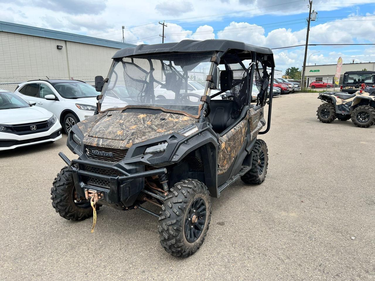 <p data-start=159 data-end=501>The 2021 Honda Pioneer 1000-5 is built to tackle tough jobs and rugged trails with unmatched versatility, comfort, and reliability. Powered by a proven 999cc liquid-cooled twin-cylinder engine with a 6-speed automatic DCT transmission, it delivers smooth, instant power whether youre hauling gear or exploring backcountry trails.</p><p data-start=159 data-end=501>&nbsp;</p><p data-start=503 data-end=787>This 5-seater side-by-side is designed for both work and play, featuring Honda&rsquo;s exclusive QuickFlip&reg; seating system that allows you to convert the rear cargo bed into two additional seats in seconds &mdash; perfect for bringing along the whole crew or maximizing your hauling capacity.</p><p data-start=503 data-end=787>&nbsp;</p><p data-start=789 data-end=1106>With independent front and rear suspension, high ground clearance, and turf/2WD/4WD with differential lock, the Pioneer 1000-5 offers confident handling in varied terrain, from muddy job sites to rocky trails. It&rsquo;s equipped with self-leveling rear suspension, ensuring a balanced ride even under load.</p><p data-start=789 data-end=1106>&nbsp;</p><p data-start=1108 data-end=1135>Other key features include:</p><ul data-start=1137 data-end=1439><li data-start=1137 data-end=1197><p data-start=1139 data-end=1197>Electronic Power Steering (EPS) for smoother control</p></li><li data-start=1198 data-end=1252><p data-start=1200 data-end=1252>12.4&rdquo; ground clearance and durable skid plates</p></li><li data-start=1253 data-end=1321><p data-start=1255 data-end=1321>1,000 lb cargo bed capacity and 2,000 lb towing capacity</p></li><li data-start=1322 data-end=1380><p data-start=1324 data-end=1380>Comfortable bench seating with seat belts for five</p></li><li data-start=1381 data-end=1439><p data-start=1383 data-end=1439>Digital display, 12V power outlet, and tilt steering</p></li></ul><p data-start=1441 data-end=1657>&nbsp;</p><p data-start=1441 data-end=1657>Whether you&rsquo;re working hard on the farm or exploring the backwoods with family and friends, the 2021 Honda Pioneer 1000-5 delivers dependable performance, legendary durability, and flexible utility for any adventure.</p><p data-start=125 data-end=464>&nbsp;</p><p data-start=1659 data-end=1743>Contact us today to learn more about financing options and Canada-wide delivery.</p>