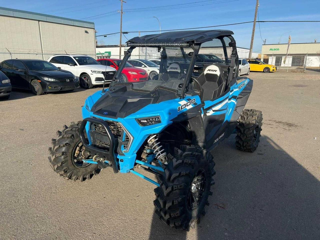 <p data-start=119 data-end=425>The 2018 Polaris RZR XP 1000 with Ride Command is engineered for riders who crave power, precision, and control on every trail. Powered by a 110-horsepower ProStar 999cc engine, this high-performance side-by-side delivers instant throttle response and the proven reliability Polaris is known for.</p><p data-start=119 data-end=425>&nbsp;</p><p data-start=427 data-end=843>Built for aggressive trail and dune riding, the RZR XP 1000 features Walker Evans Needle Shocks with 16 inches of rear and 14 inches of front suspension travel, giving you the confidence to push through whoops, rocks, and rough terrain with ease. The 64-inch width and 90-inch wheelbase deliver a perfect balance of stability and agility, whether you&rsquo;re carving corners or charging open ground.</p><p data-start=427 data-end=843>&nbsp;</p><p data-start=845 data-end=1208>This Ride Command edition adds advanced technology and premium comfort, including a 7-inch touchscreen display with GPS navigation, Bluetooth connectivity, and front/rear cameras. You&rsquo;ll also find full doors, LED lighting, premium seats, and 29-inch Maxxis Big Horn tires mounted on 14-inch aluminum wheels for excellent traction and durability.</p><p data-start=845 data-end=1208>&nbsp;</p><p data-start=1210 data-end=1368>With its blend of power, precision, and technology, the 2018 RZR XP 1000 Ride Command edition is built to take every adventure further and in total control.</p><p data-start=109 data-end=437>&nbsp;</p><p data-start=1370 data-end=1461>Contact us today to learn more about financing, trade-ins, or delivery across Canada!</p>