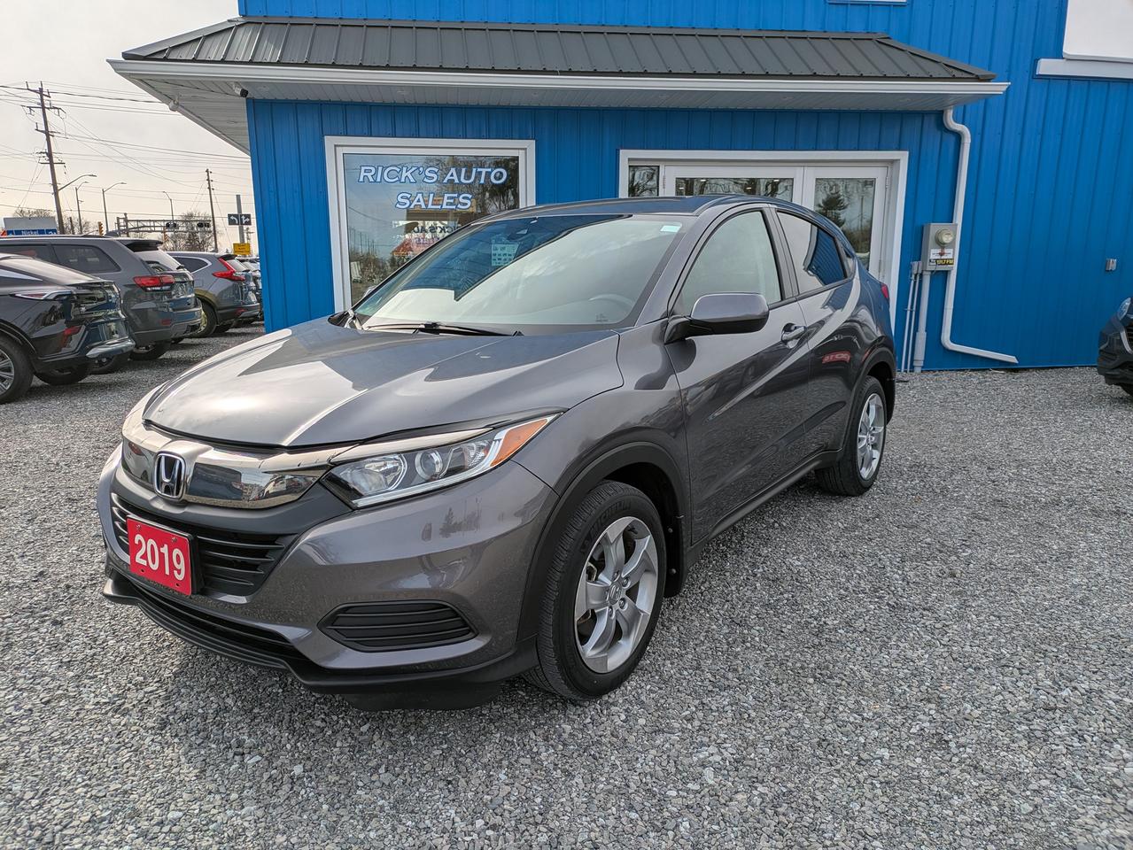 <p>Looking for a versatile and reliable SUV thats perfect for navigating Canadian roads? Check out this sleek, gray 2019 Honda HR-V LX, available now at Ricks Auto Sales! This compact crossover is ready to take on your daily commute, weekend adventures, and everything in between. With only 47,939 km on the odometer, this HR-V is just getting started, promising years of dependable performance. Its fuel-efficient gasoline engine and smooth Variable Transmission (CVT) make for a comfortable and economical driving experience.</p><p>This HR-V LX is a practical and stylish choice. The gray exterior and interior create a timeless aesthetic, while the four-door design offers easy access for passengers and cargo. Front-wheel drive provides excellent handling in various conditions. This SUV is ready to enhance your driving experience.</p><p>Here are some of the standout features of this 2019 Honda HR-V LX:</p><ul><li><strong>Fuel Efficiency:</strong> Enjoy great gas mileage, saving you money on your daily drives.</li><li><strong>Spacious Interior:</strong> Despite its compact size, the HR-V offers a surprisingly roomy cabin for both passengers and cargo.</li><li><strong>Reliable Honda Engineering:</strong> Benefit from Hondas renowned reputation for dependability and long-lasting quality.</li><li><strong>Smooth CVT Transmission:</strong> Experience seamless acceleration and a comfortable ride.</li><li><strong>Versatile Design:</strong> Perfect for city driving or weekend getaways, the HR-V adapts to your lifestyle.</li><li><strong>CLEAN CARFAX</strong></li></ul><p><strong><em>Powered by AutoIntelligence&trade;</em></strong> Vehicle information has been generated using artificial intelligence and is provided for informational purposes only. While efforts are made to ensure accuracy, please confirm all details directly with the dealer.</p><p>&nbsp;</p><p class=MsoNormal>This vehicle is offered at Rick&rsquo;s Auto Sales, your Hometown Pre-Owned Sales Centre.<span style=mso-spacerun: yes;>&nbsp; </span>As an Independently Owned and operated Automotive Centre for nearly 20 years, we know our customers are the core of our business.<span style=mso-spacerun: yes;>&nbsp; </span>We pride ourselves on providing our customers with heartfelt service, and Honesty and Integrity is our motto.</p><p class=MsoNormal>** ALL PRICES ARE PLUS HST, LIC, OMVIC & $199 ADMIN FEE** We service what we sell!<span style=mso-spacerun: yes;>&nbsp; </span>The purchase price INCLUDES Certification with a 30-day/1500 km warranty covering any mechanical issues.<span style=mso-spacerun: yes;>&nbsp; </span>Vehicles come standard with ONE key (if we receive more than ONE key, we will include it).<span style=mso-spacerun: yes;>&nbsp; </span>Options to purchase additional warranty and corrosion-free rustproofing are also available.<span style=mso-spacerun: yes;>&nbsp; </span>Financing is available on qualifying vehicles.</p><p class=MsoNormal>We service the entire Niagara Region and beyond!<span style=mso-spacerun: yes;>&nbsp; </span>**CHECK OUT OUR REVIEWS AND OUR FACEBOOK PAGE**</p><p class=MsoNormal>Book an appointment or stop in for a test drive TODAY, you won&rsquo;t be disappointed!</p><p class=MsoNormal>Rick&rsquo;s Auto Sales (UCDA MEMBER) BUY WITH CONFIDENCE</p><p>&nbsp;</p>