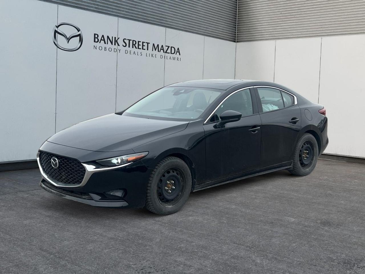 Elevate your daily drive with this exceptional 2019 Mazda Mazda3 GT, a sophisticated sedan engineered for thrilling performance and unparalleled comfort. This striking 4-door i-ACTIV All-Wheel Drive model combines Mazdas renowned KODO design philosophy with the advanced technology of the premium GT trim. With 94,162 kilometers, this Mazda3 GT stands ready to deliver an engaging and reliable driving experience, showcasing its meticulous design and robust build quality. Step inside and discover a cabin meticulously crafted for the discerning driver. Experience instant luxury with sumptuous Leather Seats and stay cozy on cooler days thanks to the Heated Seats and Heated Steering Wheel. Connectivity is seamless with Apple CarPlay / Android Auto integration and Bluetooth, ensuring your favorite apps and media are always at your fingertips, all channeled through an immersive Premium Bose Audio system. Navigate with confidence using the integrated Navigation System and enjoy the open sky through the Power Moonroof / Sunroof. Convenience is paramount with Keyless Entry & Start, Adaptive Cruise Control for effortless highway travel, and advanced driver-assistance features like Blind Spot Monitor, Lane Departure Warning, and Rear Parking Assist to enhance safety and awareness on every journey. Under the hood, this Mazda3 GT is powered by a responsive 2.5L SKYACTIV-G DOHC 16-Valve I4 engine, paired with a smooth 6-Speed SKYACTIV-Drive Automatic Transmission. This powertrain delivers an impressive 186 horsepower and 186 lb-ft of torque, providing spirited acceleration while maintaining remarkable fuel efficiency at 9.2 L/100km city and 7 L/100km highway (25.6 MPG city, 33.6 MPG highway). The intelligent i-ACTIV All-Wheel Drive system ensures superior traction and control in various driving conditions, making it an ideal companion for any adventure. Key Features & Specifications: Engine: 2.5L SKYACTIV-G DOHC 16-Valve I4 (186 hp, 186 lb-ft torque) Transmission: 6-Speed SKYACTIV-Drive Automatic Drive Type: i-ACTIV All-Wheel Drive (AWD) Fuel Economy: 9.2 L/100km city / 7 L/100km highway Premium Leather Seats Heated Front Seats and Heated Steering Wheel Power Moonroof / Sunroof Apple CarPlay / Android Auto Integration Bluetooth Hands-Free Connectivity Navigation System (MAZDA CONNECT) Bose Premium Audio System with 12 Speakers and Satellite Radio (SiriusXM compatible) Adaptive Cruise Control (Mazda Radar Cruise Control - MRCC) Keyless Entry & Push Button Start Lane Departure Warning (Lane-Keep Assist System - LAS) Blind Spot Monitor (Advanced Blind Spot Monitoring - ABSM) Rear Parking Assist (Exterior parking camera rear, rear parking sensors) Dual-Zone Automatic Climate Control Power Driver Seat with Memory Function and Lumbar Support Heads-Up Display (Active Driving Display) Auto-Dimming Rearview and Door Mirrors Homelink Garage Door Transmitter Full LED Lighting (Headlights, Taillights, DRLs) 18-inch Alloy Wheels Forward Collision Mitigation (Smart City Brake Support - SCBS) Rear Collision Mitigation (Smart Brake Support Rear - SBS-R) This 2019 Mazda Mazda3 GT is more than just a car; its a testament to Mazdas commitment to driving pleasure and sophisticated design. Dont miss your opportunity to own this well-equipped, high-performance sedan. Contact us today to schedule your personalized test drive!