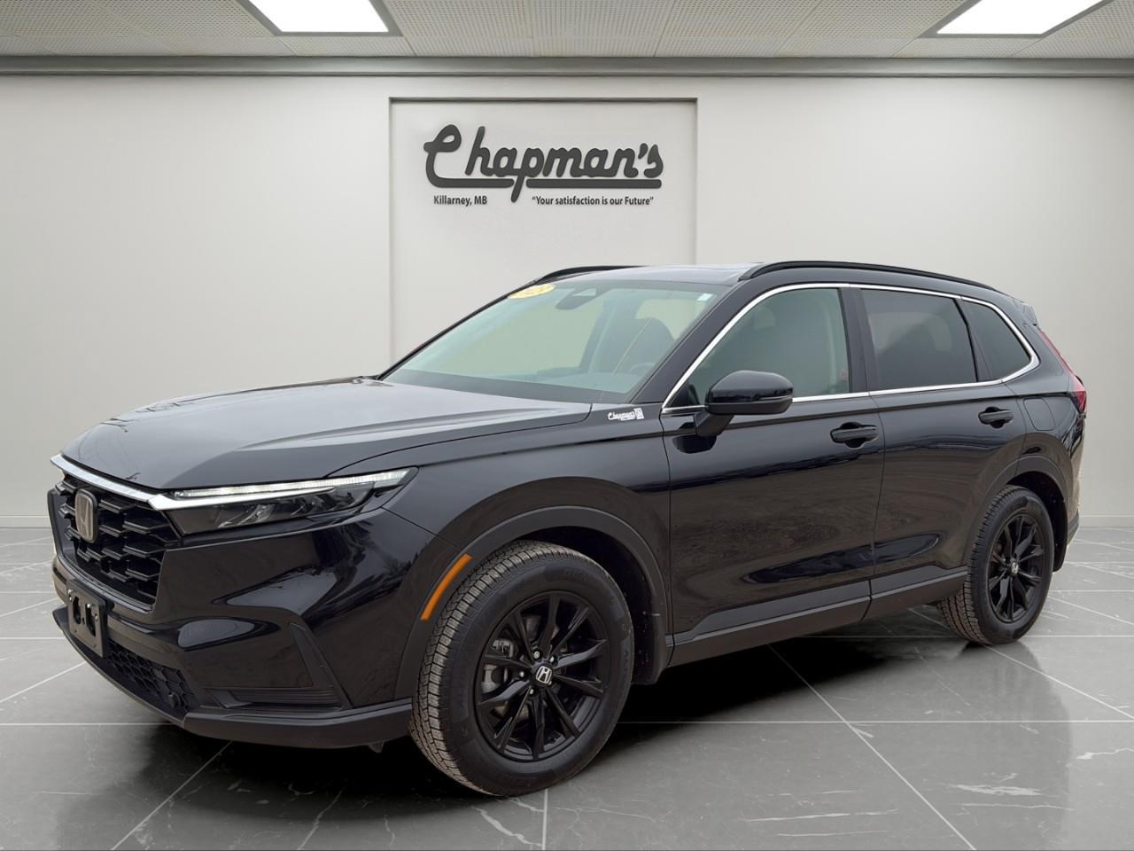 <p><strong>2 Sets of Tires/Rims Included!</strong></p><p>Finished in Black with a Black interior, this 2023 Honda CR-V Sport AWD delivers a sleek, modern look with everyday practicality. With its sporty styling and versatile cabin, its a compact SUV designed for commuting, family use, and everything in between.</p><p>Powered by a 1.5L turbocharged 4-cylinder engine paired with a continuously variable transmission (CVT), this CR-V offers smooth, efficient performance. With full-time all-wheel drive and composed handling, it provides confident traction and comfort in all driving conditions.</p><h3>Performance & Capability</h3><ul><li><p>1.5L turbocharged 4-cylinder engine</p></li><li><p>Continuously variable transmission (CVT)</p></li><li><p>Full-time all-wheel drive (AWD)</p></li><li><p>Drive mode select</p></li><li><p>Hill descent control</p></li><li><p>Electric power steering</p></li><li><p>Independent suspension system</p></li></ul><h3>Interior Comfort & Convenience</h3><ul><li><p>Heated front seats</p></li><li><p>8-way power driver seat with lumbar support</p></li><li><p>Heated leather-wrapped steering wheel</p></li><li><p>Dual-zone automatic climate control</p></li><li><p>Power sunroof</p></li><li><p>60/40 split-folding rear seats</p></li><li><p>Spacious cargo area with concealed storage</p></li></ul><h3>Technology & Connectivity</h3><ul><li><p>Apple CarPlay & Android Auto</p></li><li><p>Bluetooth hands-free connectivity</p></li><li><p>Driver information display</p></li><li><p>Steering wheel-mounted controls</p></li><li><p>Multiple 12V power outlets</p></li></ul><h3>Safety & Driver Assistance</h3><ul><li><p>Honda Sensing suite</p></li><li><p>Collision Mitigation Braking System</p></li><li><p>Forward collision warning</p></li><li><p>Adaptive cruise control with low-speed follow</p></li><li><p>Traffic jam assist</p></li><li><p>Driver attention monitor</p></li><li><p>Rearview camera</p></li><li><p>Lane keeping assist</p></li></ul><h3>Exterior Highlights</h3><ul><li><p>Black exterior finish</p></li><li><p>LED headlights with automatic high beams</p></li><li><p>Power heated mirrors with turn signal indicators</p></li><li><p>Deep tinted rear glass</p></li><li><p>Black exterior accents with chrome window trim</p></li><li><p>Rear window wiper and defroster</p></li></ul><p>A stylish and efficient AWD SUV that delivers comfort, advanced safety, and everyday versatility for modern drivers.</p><p>Price Includes Dealer Fee.</p><p>Price Excludes PST & GST.</p><p>Financing Options Available, Call For More Details.</p> <p><strong>*While every reasonable effort is made to ensure the accuracy of this information, we are not responsible for any error or omissions contained on these pages. Please verify any information in question with Chapman Motors Ltd.</strong></p>