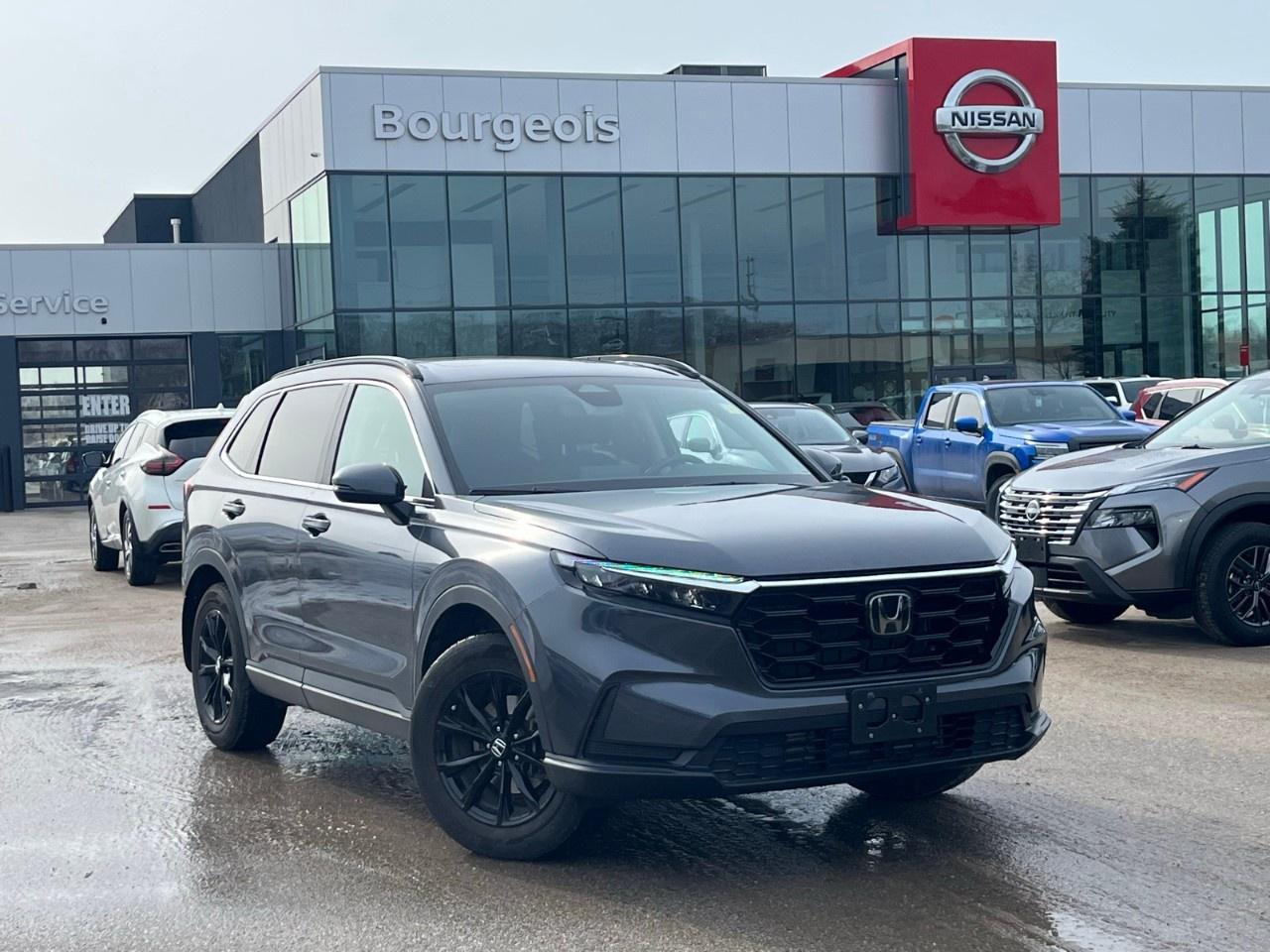 <p>Experience the 2024 Honda CR-V Sport AWD in a sophisticated Gray exterior paired with an intuitive automatic transmission. This SUV, known for its reliable all-wheel drive, ensures adept handling across various terrains, making it a perfect companion for both city streets and country roads.</p><p>Step inside to a Black interior that effortlessly combines comfort with a touch of elegance. The interior design is complemented by modern amenities including heated front seats, a heated steering wheel, and a leather steering wheel, enhancing your driving comfort all year round. Notable exterior features include heated mirrors and a stylish sunroof, offering a blend of practicality and style.</p><p>The 2024 CR-V Sport AWD is equipped with cutting-edge technology and safety features, ensuring peace of mind on every journey. Enjoy seamless connectivity with smart device integration, a backup camera, and Bluetooth connection. The adaptive cruise control and lane assist features work together to provide you with stress-free driving. Utilize the remote start feature for added convenience, especially during those chilly mornings.</p><p>If you're an adventurous driver who values both performance and stylish safety features, the 2024 Honda CR-V Sport AWD is the ideal choice for you. Don't miss the opportunity to own this versatile SUV designed to enhance your driving experience. Contact us today to learn more and take a closer look at this vehicle.</p>