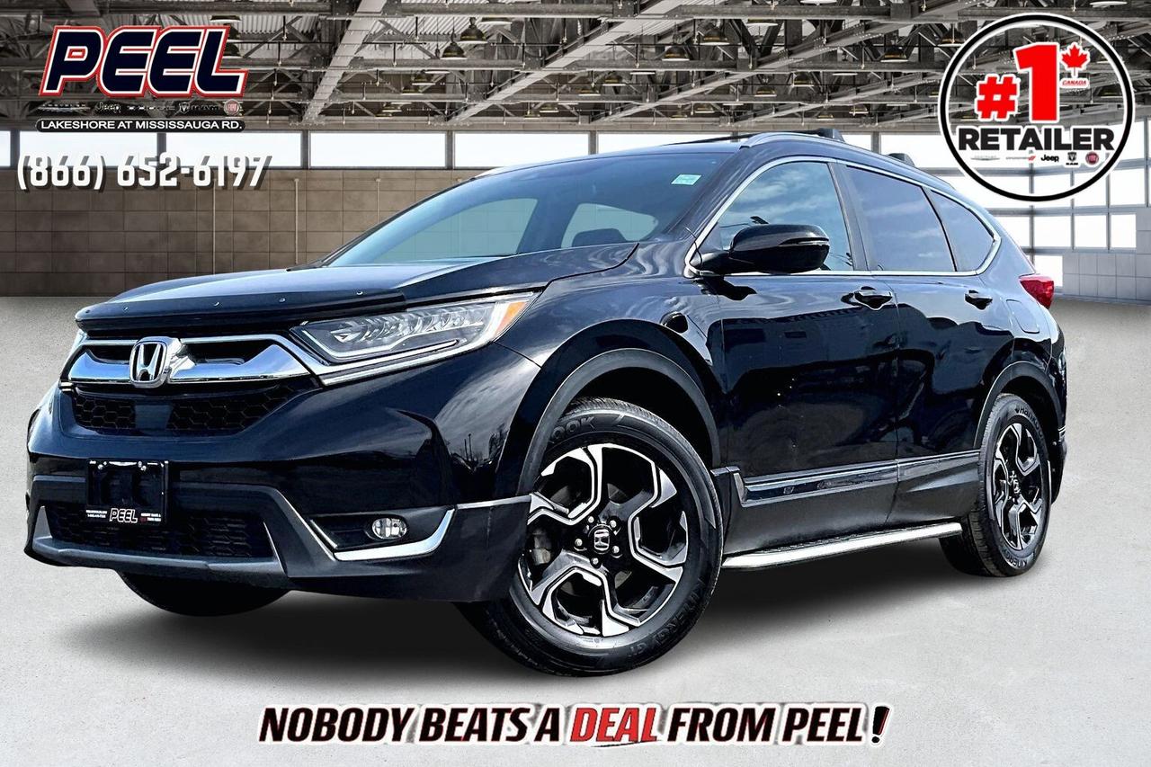 COME SEE WHY NOBODY BEATS A DEAL FROM PEEL! Your Source for ALL make and models used cars and trucks. The True #1 Stellantis Retailer in Ontario for 14 years and running!! (*)

2017 Honda CR-V Touring AWD | 1.5L Turbocharged I-4 Engine | Crystal Black Pearl | Heated Leather Seats | Touchscreen Display w/ Navigation | Dual-pane Panoramic Sunroof | Premium Audio System | Honda Sensing | Adaptive Cruise Control | Lane Keep Assist System | Forward Collision Warning | Blind Spot Monitoring | Heated Steering Wheel | Remote Start | Driver Seat Memory Positions | Dual-zone Automatic Climate Control | 18" Alloy Wheels | Power Liftgate 

One Owner Clean Carfax Low Mileage

Versatile, refined, and ready for anything, this low-mileage 2017 Honda CR-V Touring in Crystal Black Pearl delivers premium comfort and confidence on every drive. Powered by a spirited 1.5 L turbocharged engine and paired with all-wheel drive, it offers both strong performance and capable handling in diverse conditions. The cabin invites you in with heated leather seats, a heated steering wheel, driver-seat memory settings, and a dual-pane panoramic sunroof that opens up the space with natural light. Inside, a touchscreen with navigation, dual-zone climate control, remote start, and a power liftgate combine for seamless convenience. Safety technology takes center stage thanks to Honda Sensing, featuring adaptive cruise control, lane-keep assist, forward collision warning, and blind-spot monitoring for peace of mind at every turn. With one owner and a Clean Carfax, this Touring AWD delivers the full package of luxury, technology, and reliability, the ideal choice for drivers who expect more from their crossover.
______________________________________________________

Engage & Explore with Peel Chrysler: Whether youre inquiring about our latest offers or seeking guidance, 1-866-652-6197 connects you directly. Dive deeper online or connect with our team to navigate your automotive journey seamlessly.

WE TAKE ALL TRADES & CREDIT. WE SHIP ANYWHERE IN CANADA! OUR TEAM IS READY TO SERVE YOU 7 DAYS!
______________________________________________________
Our advertised prices are for consumers (i.e end users) only. 

*FREE CarFax (click the link above to check it out at no cost to you!)*

*FULLY CERTIFIED! (Have you seen some of these other dealers stating in their advertisements that certification is an additional fee? NOT HERE! Our certification is already included in our low sale prices to save you more!)

(*) Based on the Eastern Business Center National Ranking reported sales to actual customers, not including demonstrators.
______________________________________________________

Peel Chrysler  A Trusted Destination: Based in Port Credit, Ontario, we proudly serve customers from all corners of Ontario and Canada including Toronto, Oakville, North York, Richmond Hill, Ajax, Hamilton, Niagara Falls, Brampton, Thornhill, Scarborough, Vaughan, London, Windsor, Cambridge, Kitchener, Waterloo, Brantford, Sarnia, Pickering, Huntsville, Milton, Woodbridge, Maple, Aurora, Newmarket, Orangeville, Georgetown, Stouffville, Markham, North Bay, Sudbury, Barrie, Sault Ste. Marie, Parry Sound, Bracebridge, Gravenhurst, Oshawa, Ajax, Kingston, Innisfil and surrounding areas. On our website www.peelchrysler.com, you will find a vast selection of new vehicles including the new and used Ram 1500, 2500 and 3500. Chrysler Grand Caravan, Chrysler Pacifica, Jeep Cherokee, Wrangler and more. All vehicles are priced to sell. We deliver throughout Canada. website or call us 1-866-652-6197. 

Disclaimer Statement: At Peel Chrysler, your satisfaction is our priority. While many pre-owned vehicles originally come with two keys, variations may occur based on trade-ins, and all Peel Chrysler Pre-Owned Vehicles come standard with one key. Any extras provided by the previous owner will be included with your purchase, and additional keys can be bought at the time of sale. Online prices and payments are for finance purchases. Used vehicles that are being financed are subject to a $499 (^$1500 non-prime) financing fee, while cash purchases (certified cheque, bank draft, or wire transfer) on used vehicles have a $2,000 surcharge ( online price + $2,000). Cash purchases of new vehicles only incur applicable taxes and licensing fees, and those priced above $100,000 (including accessories or add-ons) are subject to a federal luxury tax. Optional finance and lease terms are available, and if trading in a vehicle with an outstanding loan balance requiring Peel Chrysler to facilitate the lien payout, a Lien Payout Fee of $349 applies. Prices, rates, and payments are subject to change without notice. While we strive for accuracy, occasional technical or human errors may occur, so we encourage verifying all vehicle details, including features, options, materials, and specifications, with a Peel Chrysler representative by contacting us or visiting our dealership. Experience seamless convenience with our nationwide delivery options. Visit our website or contact us for more details.