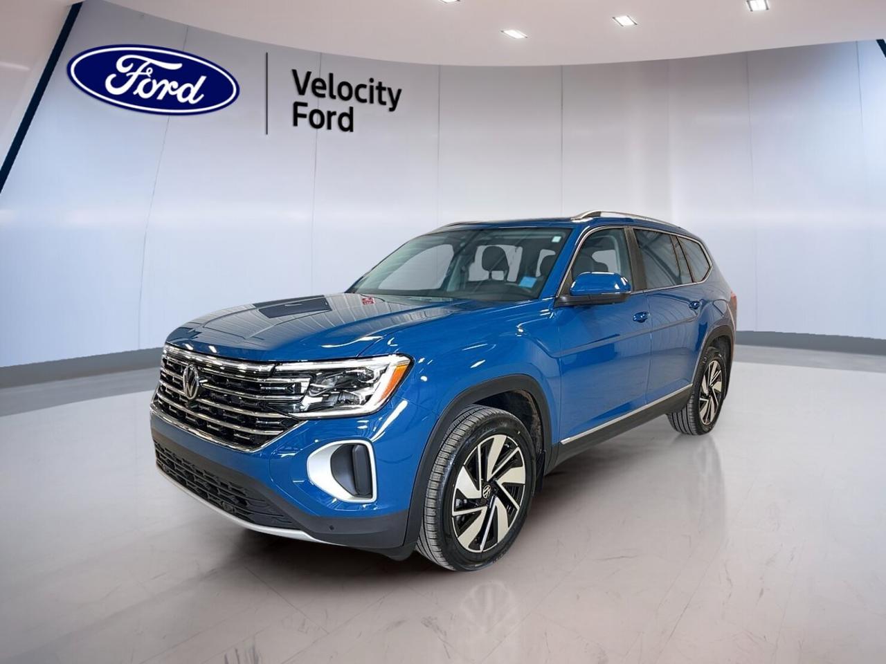 Meet the 2025 Volkswagen Atlas Highline 2.0 TSI 4MOTION, a used SUV that brings family-size space, refined comfort, and confident all-weather traction to every trip. Finished in Blue with a Black interior, this four-door Atlas Highline 2.0 TSI 4MOTION has 28,179 km and an 8-speed automatic transmission.

Sold by Velocity Ford in Moose Jaw, this 2025 Volkswagen Atlas Highline 2.0 TSI 4MOTION is powered by a 2.0-litre unleaded engine and built to handle daily driving with ease. Its panoramic sunroof, navigation system, heated seats, and smart safety features help make every drive more enjoyable and more secure.

FEATURES OF THE Atlas Highline 2.0 TSI 4MOTION
»» Panoramic sunroof adds open-air cabin feel
»» 4MOTION all-wheel drive boosts year-round traction
»» Navigation system helps guide every trip
»» Power liftgate adds easy cargo access

ADVANCED SAFETY FEATURES
»» Backup camera helps with reversing confidence
»» Blind spot monitor supports safer lane changes
»» Lane departure warning adds driving awareness
»» Multiple airbags help protect occupants

PERFORMANCE AND EFFICIENCY
»» 2.0-litre turbo engine delivers smooth power
»» 8-speed automatic supports relaxed highway cruising
»» All-wheel drive improves grip in weather
»» Stability control helps maintain road composure

COMFORT AND CONVENIENCE
»» Heated front seats add cold-weather comfort
»» Heated rear seats help keep passengers warm
»» Dual-zone climate control improves cabin comfort
»» Remote starter adds convenience on cold mornings

TECHNONOLGY AND CONNECTIVITY
»» Bluetooth integration supports hands-free phone use
»» Navigation system helps simplify unfamiliar routes
»» WiFi hotspot keeps devices better connected
»» Steering wheel audio controls ease access

CARGO SPACE
»» Power liftgate makes loading more convenient
»» Cargo cover helps conceal stored items
»» Rear trunk access improves everyday usability
»» Large SUV shape supports family hauling

WHAT OTHER OWNERS LIKE
»» Spacious cabin suits families and road trips
»» Strong visibility helps daily driving confidence
»» Comfortable ride feels smooth on highways
»» Useful technology makes travel easier

The Blue exterior gives this Volkswagen a clean, upscale look, while tinted windows, LED headlamps, fog lights, heated mirrors, and retractable mirrors add useful function. A rear spoiler and performance tires complete the design with a sporty touch that fits this versatile SUV well.

Inside, this Atlas focuses on comfort and simple control. You get front air conditioning, automatic climate control, rear climate control, rear air conditioning, power windows, power steering, an adjustable steering wheel, memory seats, a power drivers seat, a power passenger seat, and drivers seat lumbar support.

Convenience is a clear strength in this Volkswagen. Push-button start, cruise control, automatic headlights, an auto-dimming rearview mirror, remote starter, remote trunk release, automatic door locks, and illuminated vanity mirrors help make each drive easier, whether you are commuting across town or heading out on the highway.

This SUV also gives you practical peace of mind with anti-lock braking system, tire pressure monitoring, child safety locks, passenger airbag sensor, rear window defroster, and a spare tire. With its smart mix of comfort, space, traction, and technology, this Atlas is ready for busy family life in Saskatchewan.

This 2025 Volkswagen Atlas Highline 2.0 TSI 4MOTIONs VIN is: 1V2BR2CA5SC546985.