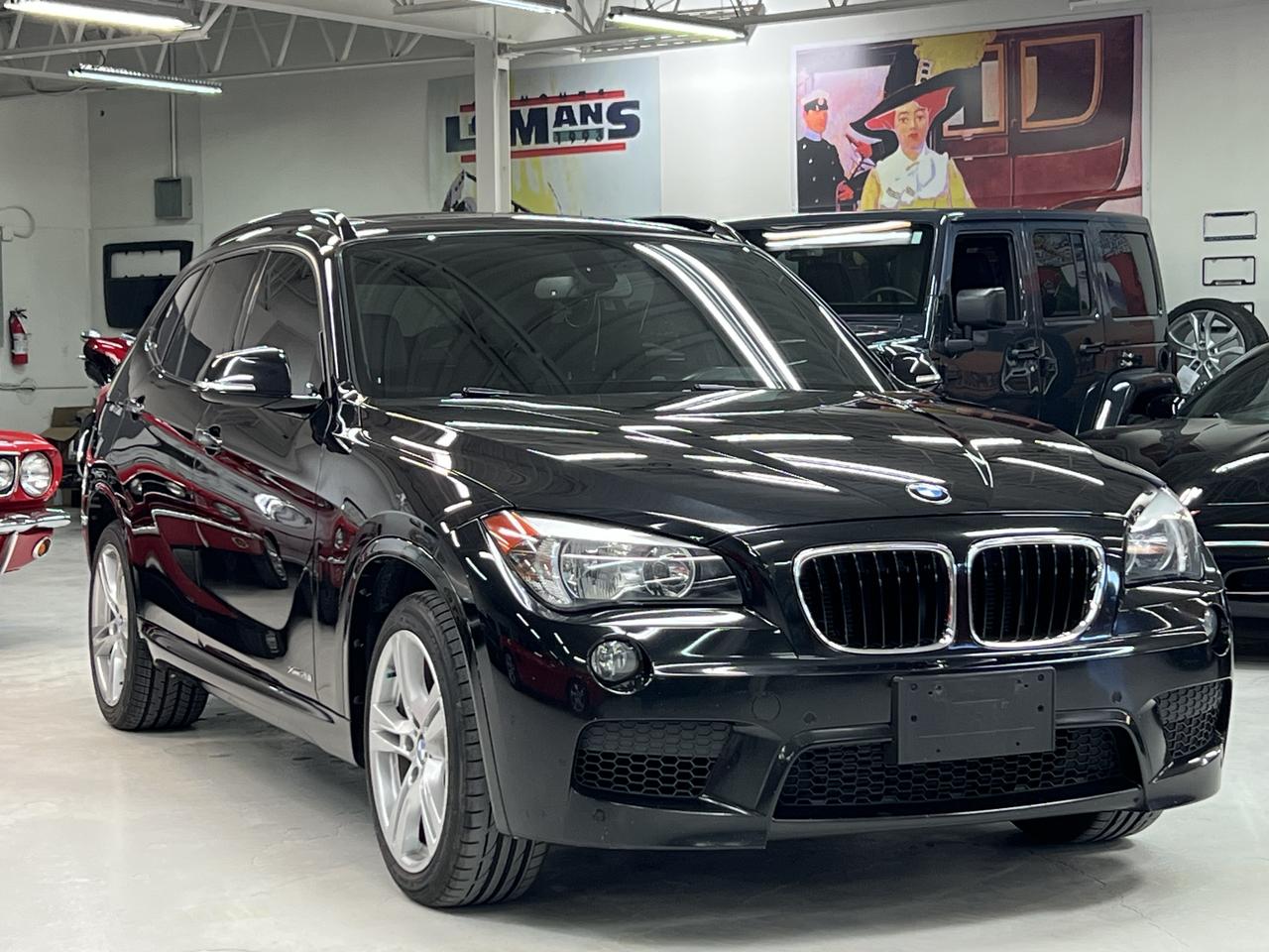 <p>2015 BMW X1 xDrive28i M Sport</p><p>113,000 km | Black Sapphire Metallic | AWD</p><p>A well-optioned and properly maintained X1, finished in Black Sapphire Metallic with M Sport package.</p><p>This is the right spec&mdash;xDrive AWD, turbocharged power, and the full M Sport appearance and driving package&mdash;offering a great balance of performance, practicality, and with heated seats and winter and summer wheels and tires, year-round usability.</p><p>With 113,000 km, it has been well cared for and presents exactly as it should. Serviced at the BMW dealership from new.&nbsp;</p><p>Highlights</p><p>2.0L Turbocharged 4-cylinder (242 HP)</p><p>Automatic transmission</p><p>xDrive All-Wheel Drive</p><p>M Sport Package</p><p>M Aerodynamics package</p><p>M Sport steering wheel with paddle shifters</p><p>Sport suspension</p><p>18&rdquo; M Double-Spoke wheels</p><p>Black Sapphire Metallic</p><p>Panoramic sunroof</p><p>Navigation (Professional)</p><p>Heated front seats</p><p>Power seats with memory</p><p>Comfort Access (keyless entry)</p><p>Park Distance Control (PDC)</p><p>Cruise control with braking function</p><p>&nbsp;</p><p>This X1 has been:</p><p>Fully inspected, Serviced as required, Professionally detailed, It drives tight and performs exactly as expected.</p><p>Buying with Confidence</p><p>We don&rsquo;t offer traditional test drives. Instead, every vehicle is thoroughly inspected and documented.</p><p>72-Hour Money-Back Guarantee<br>Buy with confidence&mdash;whether in person or from a distance.</p><p>Additional Info</p><p>Canada-wide shipping available</p><p>Financing options available</p><p>Trade-ins welcome</p><p>Final Word</p><p>A clean, well-equipped M Sport X1 with the right colour and options&mdash;hard to find in this condition.</p><p>Lee Munro&rsquo;s Garage<br>Paris, Ontario</p><p>&ldquo;Easy to buy. A pleasure to own. Guaranteed.&rdquo;</p>