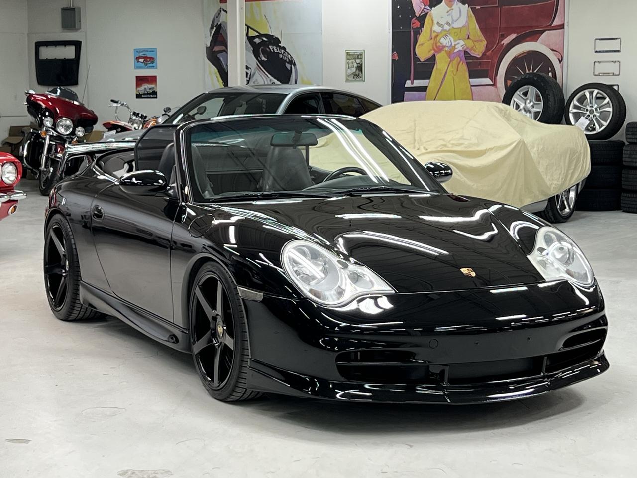 <p class=isSelectedEnd><strong>&ldquo;It&rsquo;s about the exceptional, the rare, the properly sorted.&rdquo;</strong></p><p class=isSelectedEnd>This 2002 Porsche 911 Carrera 4 Cabriolet represents something increasingly difficult to find in today&rsquo;s market &mdash; an analog-era 911 that has already been <em>done right</em>.</p><p class=isSelectedEnd>Finished in timeless Black over Black Full Leather, this example delivers the pure, connected driving experience that defines the 911 lineage &mdash; paired with the confidence of proper ownership, documented care, and key mechanical updates already addressed.</p><p>This is not a project. This is not a compromise.<br>This is the one you were hoping to find.</p><h3>Highlights & Features</h3><ul data-spread=false><li>6-Speed Manual Transmission</li><li>Carrera 4 All-Wheel Drive</li><li>115,000 KM</li><li>IMS Bearing Upgrade Completed</li><li>Full Service History from New</li><li>Sport Exhaust System (XLF)</li><li>Black Full Leather Interior</li><li>Power Seat Package</li><li>Advanced Technic & Design Packages</li><li>18 Carrera Alloy Wheels</li><li>Porsche Crests in Headrests</li><li>Ceramic Coated Exterior</li><li>Black Convertible Top</li></ul><div contenteditable=false><hr></div><h3>Condition & Ownership</h3><ul data-spread=false><li>Exceptionally well maintained and properly cared for</li><li>Long-term ownership history with documentation</li><li>Mechanically sorted with major concerns already addressed</li><li>Clean presentation inside and out</li><li>Drives exactly as a properly maintained 911 should</li></ul><div contenteditable=false><hr></div><h3>Why This 911 Matters</h3><p class=isSelectedEnd>The conversation around the 996 generation has changed.</p><p class=isSelectedEnd>Buyers are no longer searching for the cheapest entry point &mdash; they are searching for the <em>right car</em>.<br>And the right cars share a common formula:</p><p class=isSelectedEnd>✔ Manual transmission<br>✔ IMS addressed<br>✔ Documented service history<br><br></p><p class=isSelectedEnd>Examples that meet all of these criteria are becoming increasingly difficult to source &mdash; especially in this condition and configuration.</p><p>This is a driver-focused, analog 911 from a time before over-digitization &mdash; hydraulic steering, naturally aspirated power, and a level of engagement modern cars simply cannot replicate.</p><p>&nbsp;</p>