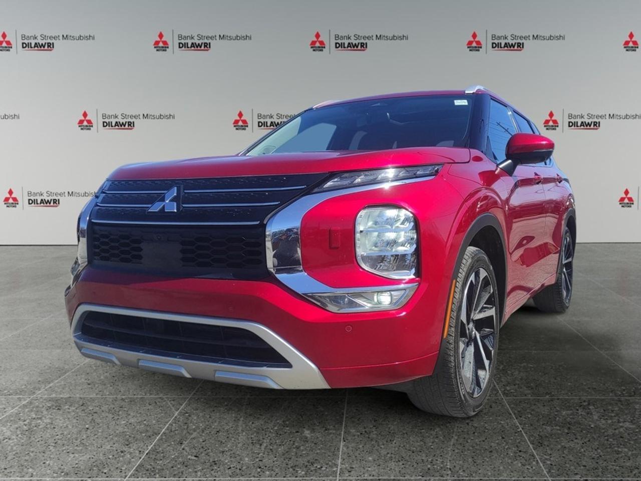 Balance of 5 year/100,000kms BASIC warranty and 10 year/160,000kms Factory Powertrain Warranty on ALL MITSUBISHI products! Best in the industry!!!! Introducing the 2022 Mitsubishi Outlander GT S-AWC, a striking red SUV equipped with a 4×4 drivetrain that promises outstanding handling in all conditions. Its confident stance and robust design make it a prominent choice for those who appreciate style alongside solid performance. The exterior of this Outlander is beautifully complemented by alloy wheels and a sleek sunroof/moonroof, enhancing its aesthetic appeal. Inside, the cabin is thoughtfully designed to provide comfort and sophistication, featuring luxurious heated seats and power-adjustable settings to ensure a personalized driving experience. Technology is at the forefront with this SUV, featuring smart device integration and a user-friendly navigation system. Stay connected safely with Bluetooth capability and enjoy your favorite tunes via satellite radio. Safety features such as a backup camera, brake assist, lane assist, and parking sensors are designed to enhance your driving confidence, offering peace of mind on every journey. Perfect for families, adventurers, or anyone looking for a versatile vehicle that blends technology, safety, and comfort seamlessly. Connect with our dealership today to learn more about the 2022 Mitsubishi Outlander GT S-AWC. Let us help you make it yours!