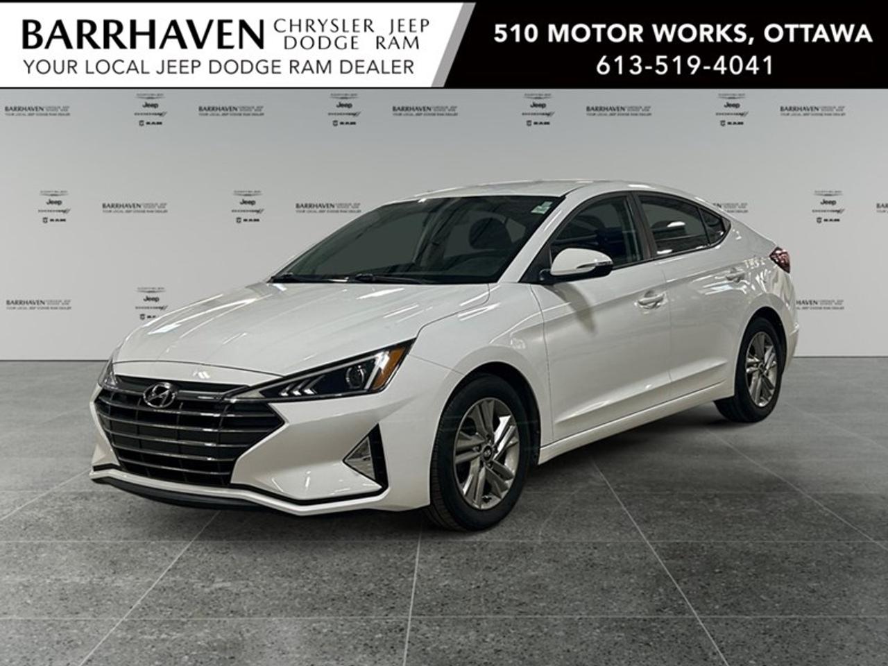 The 2020 Hyundai Elantra Preferred in a sleek white finish is an ideal blend of style and practicality, promising an enjoyable driving experience with its FWD drivetrain and smooth handling, courtesy of a robust automatic transmission. Revel in the elegance of its sedan body type, offering a sophisticated visual appeal. The Elantra Preferred boasts attractive exterior elements such as alloy wheels that enhance its graceful stance. Inside, youll find a thoughtfully designed interior featuring heated front seats for those cold Canadian winters and a leather steering wheel for added luxury. With keyless entry and power windows, convenience is never an issue. On the tech front, stay connected through the Elantras smart device integration and enjoy the added security of a backup camera. The vehicle incorporates impressive safety features such as brake assist and lane assist, ensuring peace of mind on every journey. Additionally, a heated steering wheel and heated mirrors make this car a desirable companion for all seasons. The 2020 Hyundai Elantra Preferred is perfect for individuals seeking a reliable, well-equipped, and stylish sedan. Whether youre commuting to work or heading out for weekend adventures, this vehicle offers the perfect combination of features to meet your needs. Contact our dealership today for more information or to schedule a test drive and see for yourself why the Elantra is a favorite among drivers.