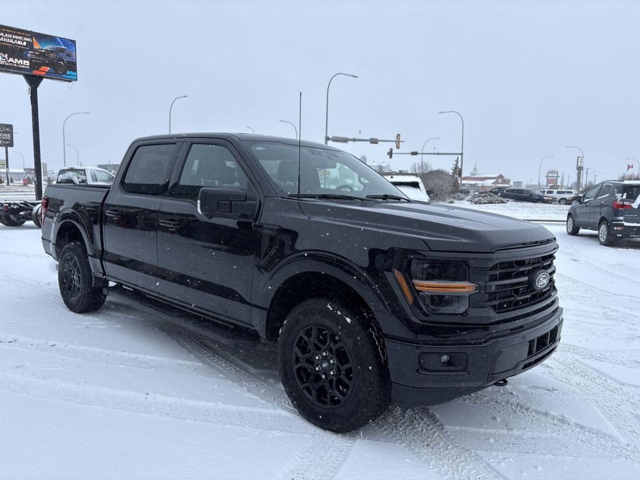 Ford Blue Advantage.  Rates from 4.69% to 5.24% available.  Comes with Blue Plan - additional 6 / 10,000KM PreimiumCare ESP, SiriusXM 3 Month Activation, Connected Services Trial 90 days, 10,000 Ford Rewards Points, Full tank of Fuel.THE PRICE YOU SEE, PLUS GST. GUARANTEED!APPLE CARPLAY/ANDROID AUTO COMPATABLE! 2.7 LITER ECOBOOST, 10 SPEED AUTO, XLT TRIM(302a), BLACK CLOTH SEAT, POWER/HEATED FRONT SEATS, POWER SLIDING REAR WINDOW, XLT BLACK APPEARANCE PKG, BED UTILITY PKG, FORD PASS CONNECT, LANE KEEPING SYSTEM, REAR BRAKE ASSIST, SYNC 4 W/12 SCREEN.      The 2024 Ford F-150 XLT with the 2.7-liter EcoBoost engine is a versatile and powerful pickup truck designed to deliver a balanced combination of performance, capability, and style. The 2.7-liter EcoBoost turbocharged V6 engine provides impressive horsepower and torque, making it well-suited for both daily driving and heavy-duty tasks. Coupled with a 10-speed automatic transmission, the F-150 offers smooth, responsive shifting and improved fuel efficiency. The XLT trim adds a range of desirable features, including advanced technology, interior comfort, and convenience options. The Black Appearance Package enhances the trucks aesthetic with blacked-out accents, grille, wheels, and trim elements, giving it a sleek and aggressive look. Additionally, the Bed Utility Package provides practical features such as a fully boxed frame, tie-downs, and possibly integrated storage options, making the truck highly functional for work and recreational activities. Overall, this configuration of the 2024 Ford F-150 XLT offers a compelling mix of rugged capability, modern amenities, and stylish design cues, ideal for those seeking a dependable, visually striking pickup.Do you want to know more about this vehicle, CALL, CLICK OR COME ON IN!*AMVIC Licensed Dealer; CarFax and Full Mechanical Inspection Included.
