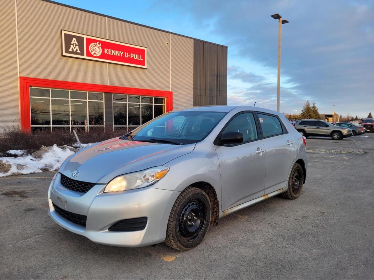 2011 Toyota Matrix (Manual) in Classic Silver Metallic. The vehicle has 252139km. The vehicle runs and drives ok. The body has multiple rust spots. Check engine light on. Transmission might need some attention. We dont perform any mechanical/safety inspections. The vehicle is sold as is and might need some work.
