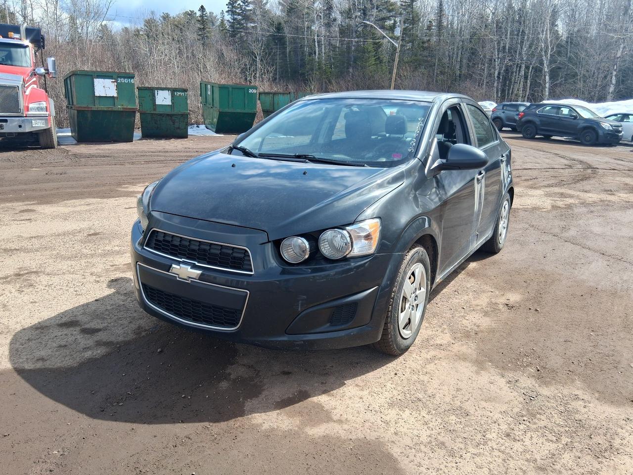 Drive away today in this jet black 2015 Chevrolet Sonic with just under 200,000 KMs. There is noticeable rust damage around the rocker panels and potentially a weak battery.