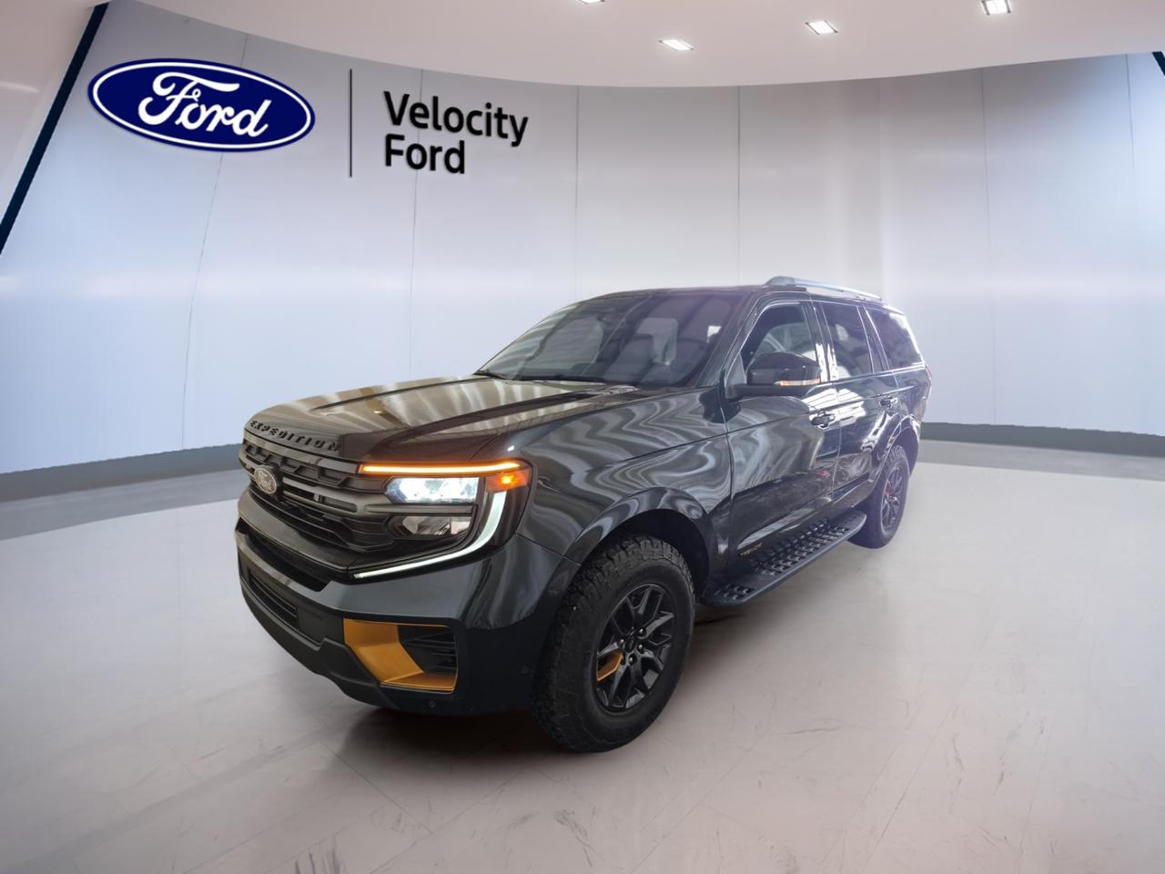 Built for families, travel, and rougher roads, this used 2025 Ford Expedition Tremor 4x4 delivers full-size SUV space with real capability. It comes finished in Black with a Black interior, four doors, and just 9,915 km on the odometer. At Velocity Ford in Moose Jaw, this Expedition Tremor 4x4 is ready for work, weekends, and long highway drives.

Power comes from a 3.5-litre unleaded engine paired with an automatic transmission and four-wheel drive. This setup gives the 2025 Ford Expedition Tremor 4x4 strong confidence in changing weather and on uneven terrain. Off-road tires, a limited slip differential, rear tow hook, and side steps add useful function without giving up daily comfort.

Inside, this full-size SUV is equipped for comfort and easy use. You get heated front seats, heated rear seats, dual-zone automatic climate control, rear climate control, rear air conditioning, memory seats, power front seats, lumbar support for driver and passenger, and adjustable pedals. A panoramic glass sunroof brings in more light and adds an open feel.

FEATURES OF THE Expedition Tremor 4x4
»» Four-wheel drive for added off-road confidence
»» Off-road tires support rougher road travel
»» Rear tow hook adds practical utility
»» Side steps ease entry and exit

ADVANCED SAFETY FEATURES
»» Backup camera helps with reversing visibility
»» Blind spot monitor supports safer lane changes
»» Lane departure warning adds extra awareness
»» Side and head airbags enhance protection

PERFORMANCE AND EFFICIENCY
»» 3.5-litre unleaded engine delivers strong output
»» Automatic transmission provides smooth daily driving
»» Four-wheel drive improves traction in weather
»» Limited slip differential aids grip off-road

COMFORT AND CONVENIENCE
»» Heated front and rear seats increase comfort
»» Dual-zone climate control keeps temperatures balanced
»» Remote starter adds convenience in cold mornings
»» Power liftgate helps with loading cargo

TECHNONOLGY AND CONNECTIVITY
»» Navigation system helps guide every trip
»» Bluetooth integration supports hands-free communication
»» WiFi hotspot keeps passengers better connected
»» Satellite radio and HD Radio included

CARGO SPACE
»» Full-size SUV design offers useful cargo room
»» Power liftgate makes access quick and easy
»» Four-door layout supports family-friendly loading
»» Large cabin suits travel and daily errands

WHAT OTHER OWNERS LIKE
»» Spacious interior for passengers and gear
»» Strong towing-ready utility and four-wheel drive
»» Comfortable ride for long family trips
»» Easy-to-use tech for daily driving

This 2025 Ford Expedition Tremor 4x4 also includes cruise control, power steering, anti-lock braking system, stability control, child safety locks, heated and retractable mirrors, power windows, steering wheel audio controls, a leather steering wheel, tinted windows, rear spoiler, automatic headlights, fog lights, tire pressure monitoring, push button start, auto-dimming rearview mirror, turn signal mirrors, rear window defroster, LED headlamps, memory mirrors, and dual shift mode transmission.

With low kilometres, a bold Black finish, and a well-equipped cabin, this 2025 Ford Expedition Tremor 4x4 offers the space many drivers need and the capability many drivers want. It is a smart choice for buyers who want a modern SUV that feels ready for every season in Saskatchewan.

This 2025 Ford Expedition Tremor 4x4s VIN is: 1FMJU1RG4SEA51940.