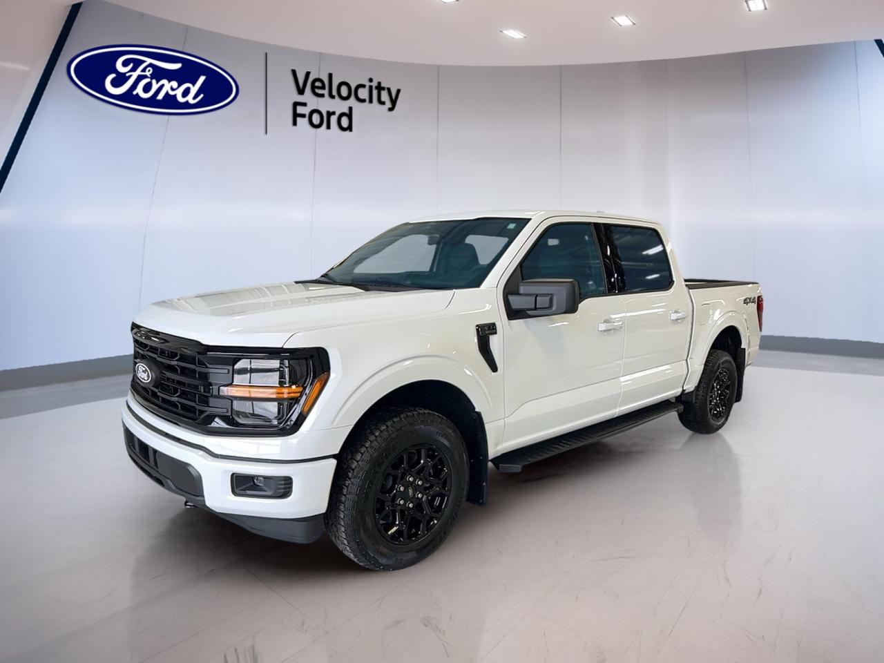 Built for hard work and daily comfort, the 2026 Ford F-150 XLT 4WD SuperCrew 5.5 Box is a brand new truck ready for life in Moose Jaw. Finished in White with a Black interior, this four-door pickup blends proven capability, smart safety, and practical features for drivers who need confidence on every drive.

With its 3.5-litre unleaded engine and automatic transmission, the 2026 Ford F-150 XLT 4WD SuperCrew 5.5 Box delivers strong performance for towing, hauling, and highway travel. Four-wheel drive adds extra grip in changing prairie weather, while the SuperCrew cab gives you roomy access for passengers, gear, and daily versatility.

FEATURES OF THE F-150 XLT 4WD SuperCrew 5.5 Box
»» Brand new full-size four-door pickup
»» 3.5-litre unleaded engine power
»» Automatic transmission with dual shift
»» White exterior with Black interior

TRUCK FEATURES
»» Towing capacity rated at 4,671 kg
»» Four-wheel drive for added traction
»» Rear tow hook for jobsite utility
»» Off-road tires support rougher terrain

ADVANCED SAFETY FEATURES
»» Backup camera helps with reversing
»» Blind spot monitor boosts awareness
»» Lane departure warning adds confidence
»» Side and head airbags included

The 2026 Ford F-150 XLT 4WD SuperCrew 5.5 Box is equipped with key driver-assist and protection features that support peace of mind. Anti-Lock Braking System, stability control, child safety locks, and tire pressure monitoring all help this truck stay ready for family use, commuting, and demanding workdays.

PERFORMANCE AND EFFICIENCY
»» 3.5-litre unleaded engine delivers power
»» Automatic transmission shifts with ease
»» Dual shift mode adds control
»» Cruise control supports relaxed highway driving

This 2026 Ford F-150 XLT 4WD SuperCrew 5.5 Box is set up for dependable performance with the strength truck owners expect. Power steering helps keep handling easy, and the balanced setup makes it well suited to towing, errands, and long drives across Saskatchewan roads.

COMFORT AND CONVENIENCE
»» Front air conditioning keeps cabin comfortable
»» Power windows add everyday ease
»» Adjustable steering wheel improves fit
»» Driver lumbar support aids comfort

Inside, the 2026 Ford F-150 XLT 4WD SuperCrew 5.5 Box focuses on simple comfort and useful convenience. Heated mirrors, electric mirrors, automatic door locks, rear window defroster, tinted windows, and illuminated vanity mirrors all help make daily driving easier in changing Canadian conditions.

TECHNONOLGY AND CONNECTIVITY
»» Bluetooth integration supports hands-free calls
»» WiFi hotspot keeps devices connected
»» Satellite radio expands entertainment choices
»» Steering wheel audio controls included

The 2026 Ford F-150 XLT 4WD SuperCrew 5.5 Box also gives you practical in-cabin tech for work and travel. Automatic headlights and LED headlamps improve visibility, while the clear control layout helps keep important functions close at hand when you are on the move.

CARGO SPACE
»» 5.5-foot box supports daily hauling
»» Rear trunk access aids loading
»» Spare tire adds roadside readiness
»» SuperCrew cabin adds storage flexibility

With a useful bed and a spacious cab, the 2026 Ford F-150 XLT 4WD SuperCrew 5.5 Box is ready for tools, supplies, groceries, and weekend gear. Its layout supports both passenger comfort and cargo flexibility, making it a smart fit for busy routines and active lifestyles.

WHAT OTHER OWNERS LIKE
»» Strong towing and hauling capability
»» Comfortable cabin for daily driving
»» Useful safety technology for confidence
»» Easy-to-use infotainment and controls

This 2026 Ford F-150 XLT 4WD SuperCrew 5.5 Boxs VIN is: 1FTFW3L81TKD73620.