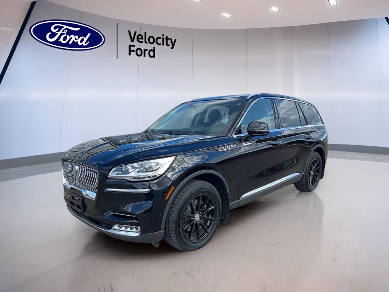 The 2022 Lincoln Aviator Reserve AWD is a premium three-row SUV that blends smooth power, refined comfort, and useful everyday features. This used example at Velocity Ford in Moose Jaw comes finished in Black with a Black interior, four doors, an automatic transmission, and a 3.0-litre unleaded engine.

With 74,477 km on the odometer, this 2022 Lincoln Aviator Reserve AWD still offers the upscale feel buyers expect from a luxury SUV. Its panoramic sunroof, power liftgate, navigation system, heated and ventilated seating features, and advanced driver aids help make every trip more relaxed and more rewarding.

FEATURES OF THE Aviator Reserve AWD
»» Panoramic sunroof adds open cabin feel
»» Navigation system supports easier route planning
»» Adjustable suspension helps refine ride comfort
»» Power liftgate adds daily loading ease

ADVANCED SAFETY FEATURES
»» Backup camera helps with safer reversing
»» Blind spot monitor aids lane awareness
»» Lane departure warning adds extra confidence
»» Stability control supports secure handling

PERFORMANCE AND EFFICIENCY
»» 3.0-litre unleaded engine delivers smooth power
»» Automatic transmission supports easy daily driving
»» All-wheel drive adds year-round traction
»» Dual shift mode allows added control

COMFORT AND CONVENIENCE
»» Heated front seats help cold mornings
»» Heated rear seats improve passenger comfort
»» Dual-zone climate control balances cabin temperatures
»» Remote starter adds convenience in winter

TECHNONOLGY AND CONNECTIVITY
»» Bluetooth integration supports hands-free calling
»» Navigation system gives clear route guidance
»» WiFi hotspot helps keep devices connected
»» Satellite radio expands entertainment choices

CARGO SPACE
»» Power liftgate simplifies cargo area access
»» Four-door design supports family-friendly loading
»» Rear area suits everyday travel gear
»» Spacious layout helps with larger items

AWARDS & RECOGNITIONS
»» Top Safety Pick, Insurance Institute for Highway Safety, 2022

WHAT OTHER OWNERS LIKE
»» Smooth power from turbocharged six-cylinder engine
»» Quiet cabin during highway travel
»» Comfortable ride with premium feel
»» Easy-to-use infotainment and climate controls

This 2022 Lincoln Aviator Reserve AWD also brings many sought-after details for daily life. Cruise control, power steering, power windows, heated mirrors, retractable mirrors, automatic headlights, tinted windows, rear air conditioning, rear climate control, memory seats, memory mirrors, and push button start all add convenience.

Inside, this 2022 Lincoln Aviator Reserve AWD is designed to keep passengers comfortable in every season. Front air conditioning, automatic climate control, rear audio controls, ambient lighting, drivers seat lumbar support, passenger lumbar support, a power drivers seat, and a power passenger seat help create a refined and accommodating space.

This 2022 Lincoln Aviator Reserve AWD also includes important protective features such as anti-lock braking system, driver airbag, passenger airbag, side impact airbags, head side airbags, child safety locks, tire pressure monitoring, passenger airbag sensor, and turn signal mirrors. LED headlamps and a rear window defroster further support visibility in changing Canadian conditions.

This 2022 Lincoln Aviator Reserve AWDs VIN is: 5LM5J7XC3NGL06483.