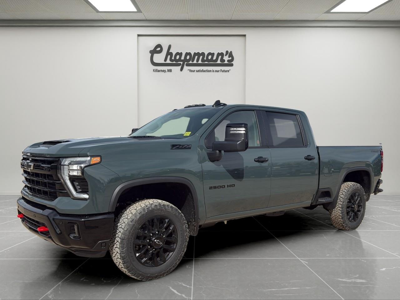 <p>Finished in Cypress Grey with a Jet Black interior, this 2026 Chevrolet Silverado 2500HD LT 4WD Crew Cab is a heavy-duty truck built for serious work and capability. With its bold styling, spacious Crew Cab layout, and Trail Boss enhancements, its designed to handle demanding jobs while still offering everyday comfort.</p><p>Powered by a 6.6L V8 engine paired with a 10-speed automatic transmission, this Silverado delivers strong, reliable performance for towing and hauling. Equipped with 4WD, Z71 off-road capability, and advanced trailering technology, its ready for job sites, trailers, and tough terrain.</p><h3>Performance & Capability</h3><ul><li><p>6.6L V8 DI engine</p></li><li><p>10-speed automatic transmission</p></li><li><p>4WD with 2-speed electronic transfer case</p></li><li><p>Auto-locking rear differential</p></li><li><p>Trailering package with hitch guidance</p></li><li><p>Integrated trailer brake controller</p></li><li><p>External engine oil cooler</p></li><li><p>Auxiliary transmission oil cooler</p></li><li><p>Z71 Off-Road Package with skid plates and hill descent control</p></li><li><p>Trail Boss Package with off-road suspension and all-terrain tires</p></li></ul><h3>Interior Comfort & Convenience</h3><ul><li><p>Leather-appointed front seats</p></li><li><p>Heated front seats</p></li><li><p>Heated steering wheel</p></li><li><p>Dual-zone automatic climate control</p></li><li><p>10-way power driver seat</p></li><li><p>Rear sliding power window</p></li><li><p>Remote vehicle start</p></li><li><p>Universal home remote</p></li><li><p>Front bucket seats with centre console</p></li><li><p>Rear 60/40 folding bench seat with underseat storage</p></li></ul><h3>Technology & Connectivity</h3><ul><li><p>13.4" touchscreen infotainment system with Google built-in</p></li><li><p>Wireless Apple CarPlay & Android Auto</p></li><li><p>12.3" digital driver information centre</p></li><li><p>SiriusXM with trial subscription</p></li><li><p>OnStar services with connectivity features</p></li><li><p>In-vehicle trailering app</p></li></ul><h3>Safety & Driver Assistance</h3><ul><li><p>HD surround vision</p></li><li><p>Bed view camera</p></li><li><p>Trailer side blind zone alert</p></li><li><p>Rear cross traffic alert</p></li><li><p>Front and rear park assist</p></li><li><p>Adaptive cruise control</p></li><li><p>Automatic emergency braking</p></li><li><p>Forward collision alert</p></li><li><p>Lane departure warning</p></li></ul><h3>Exterior Highlights</h3><ul><li><p>Cypress Grey exterior</p></li><li><p>20" high gloss black wheels</p></li><li><p>BFGoodrich off-road tires</p></li><li><p>Black grille and bowtie</p></li><li><p>High gloss black bumpers and mirror caps</p></li><li><p>Red tow hooks</p></li><li><p>Spray-on bedliner</p></li><li><p>LED headlamps and fog lamps</p></li><li><p>Power up/down tailgate</p></li><li><p>Integrated bed step and CornerStep rear bumper</p></li></ul><p>A heavy-duty truck that combines serious V8 power, advanced trailering tech, and off-road capability with everyday comfort and bold styling.</p><p>2 Year/24,000 kilometer* Complimentary Oil Changes (2 total)</p><p>3 Year/60,000 kilometer* Base Warranty Coverage</p><p>5 Year/100,000 kilometer* Powertrain Component Warranty Coverage</p><p>5 Year/100,000 kilometer* Courtesy Transportation and 24/7 Roadside Assistance</p><p>6 Year/160,000 kilometer* Sheet Metal (Rust Through) Perforation Warranty Coverage</p><p>*Whichever Comes First.</p><p>Price Includes HD Flaps & 6 Tube Steps.</p><p>Price Includes Dealer Fee.</p><p>Price Excludes PST & GST.</p><p>Financing Options Available, Call For More Details.</p> <p><strong>*While every reasonable effort is made to ensure the accuracy of this information, we are not responsible for any error or omissions contained on these pages. Please verify any information in question with Chapman Motors Ltd.</strong></p>