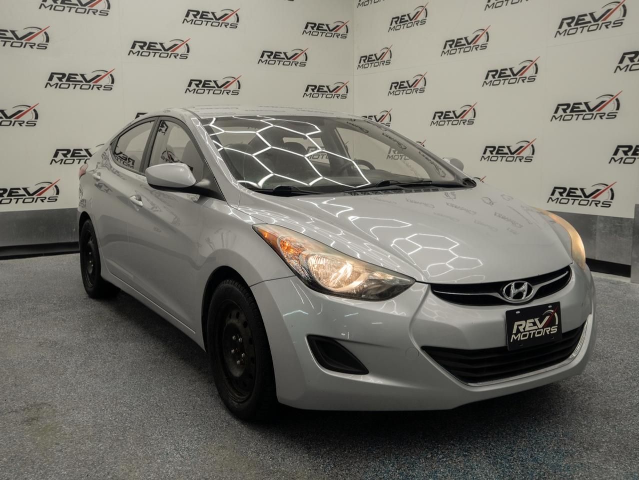 2012 Hyundai Elantra GL | Certified | Bluetooth | No Accidents<br/> <br/> Titanium Grey Exterior | Grey Interior | Alloy Wheels | 1.8L DOHC 4-Cylinder | 148 Horsepower | 6-Speed Automatic Transmission | Bluetooth® Hands-Free and more <br/> <br/> <br/> Includes a complimentary 12 Month Powertrain Warranty! <br/> <br/> <br/> The 2012 Hyundai Elantra blends efficiency, comfort, and upscale design in a compact, reliable package. <br/> <br/> <br/> Key Features: <br/> <br/> <br/> Sleek, Modern Design: <br/> The Titanium Grey finish paired with a Black leather cabin gives the Elantra a clean, stylish look. Sculpted body lines, chrome accents, and distinctive lighting make it a standout compact sedan. <br/> <br/> <br/> Efficient Performance: <br/> Powered by a 1.8L 4-cylinder engine, the Elantra delivers excellent fuel efficiency and smooth driving dynamics—ideal for commuting, city driving, and weekend trips. <br/> <br/> <br/> Smart Connectivity: <br/> Bluetooth® hands-free calling and steering-wheel-mounted controls keep your essentials accessible and convenient on the road. <br/> <br/> <br/> Reliable Safety: <br/> Equipped with stability control, ABS and multiple airbags the Elantra provides confidence and peace of mind in all driving conditions. <br/> <br/> <br/> This Vehicle Has Travelled 211,817 Kms. <br/> <br/> <br/> *** NO additional fees except for taxes and licensing! *** <br/> <br/> <br/> *** 100-point inspection on all our vehicles & always detailed inside and out *** <br/> <br/> <br/> RevMotors is at your service to ensure you find the right car for YOU. Even if we do not have it in our inventory, we are more than happy to find you the vehicle that you are looking for. Give us a call at 613-791-3000 or visit us online at www.revmotors.ca <br/> <br/> <br/> Ça nous donnera du plaisir de vous servir en Français aussi! <br/> <br/> <br/> CERTIFICATION * This vehicle is sold Certified for the province of Ontario (Quebec Safety Available, additional charges may apply) <br/> FINANCING AVAILABLE * RevMotors offers competitive finance rates through many of the major banks. Should you feel like youve had credit issues in the past, we have various financing solutions to get you on the road. We accept No Credit - New Credit - Bad Credit - Bankruptcy - Students and more!! <br/> EXTENDED WARRANTY * For your peace of mind, if one of our used vehicles is no longer covered under the manufacturer’s warranty, RevMotors will provide you with a 6 month / 6000KMS Limited Powertrain Warranty. You always have the options to upgrade to more comprehensive coverage as well. Well be more than happy to review the options and chose the coverage thats right for you! <br/> TRADES * Do you have a Trade-in? We offer competitive trade in offers for your current vehicle! <br/> SHIPPING * We can ship anywhere across Canada. Give us a call for a quote and we will be happy to help! <br/> <br/> <br/> Buy with confidence knowing that we always have your best interests in mind! <br/>