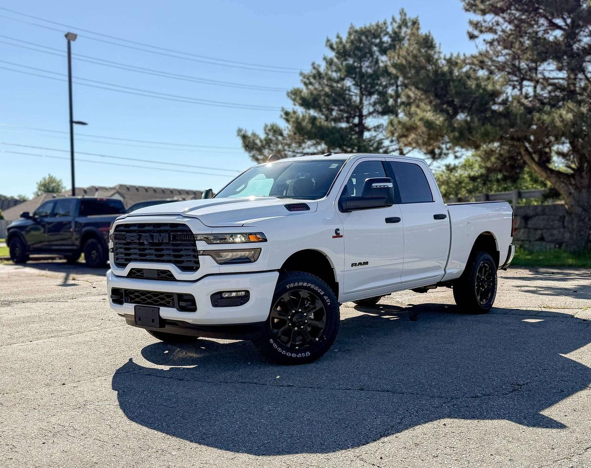 Built for strength and control, the New 2026 RAM 2500 Big Horn Crew Cab 4X4 in Bright White channels diesel power for effortless towing and confident command. Powered by a TurboCharged 6.7 Litre High Output Cummins Diesel 6 Cylinder serving up 430hp and 1075lb-ft of torque to an 8 Speed Automatic transmission. RAM comes with a heavy-duty suspension that is standard to support confident performance under load, and this Four Wheel Drive truck shows off with fog lamps and polished alloy wheels. LED bed lighting is also included to enhance convenience after dark.  Designed for hard work and everyday comfort, the Big Horn cabin features supportive cloth heated front seats, heated steering wheel, smart storage, and thoughtful amenities like keyless access, push-button ignition, and an available power drivers seat. The cabin keeps you connected through a crisp 8.4-inch Uconnect&reg; 5 touchscreen, a 7-inch driver display, voice command, Bluetooth&reg;, and full smartphone integration. With available upgrades like a 12-inch touchscreen, navigation, and premium audio, your workday can feel as refined as it is capable.  Your safety is a top concern for RAM, which has your back with forward collision warning, automatic emergency braking, electronic stability control, a rearview camera, and a suite of airbags. Our 2500 Big Horn knocks down tough challenges like a champ! Save this Page and Call for Availability. We Know You Will Enjoy Your Test Drive Towards Ownership!