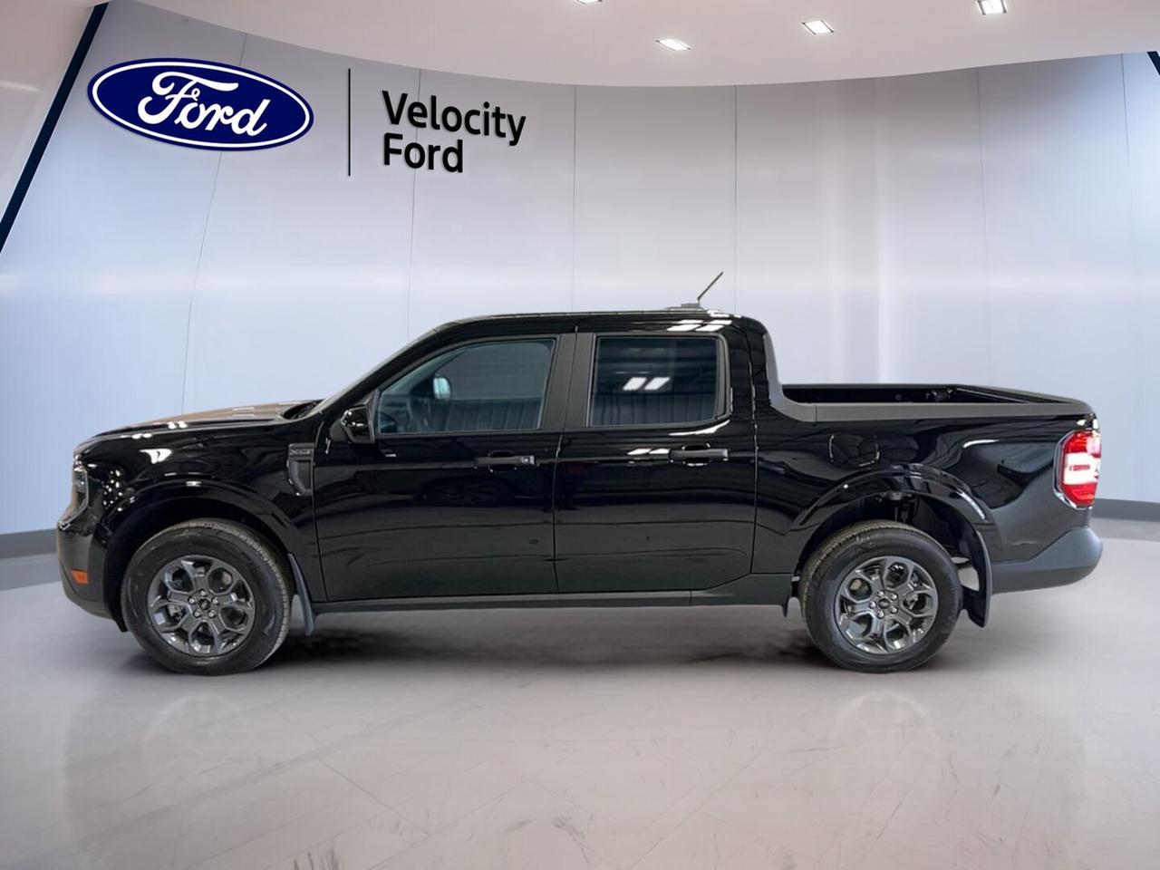 Meet the brand new 2026 Ford Maverick XLT AWD at Velocity Ford in Moose Jaw. This compact truck blends everyday ease with real pickup utility. Its Black exterior and Grey interior give it a clean, modern look, while four doors and automatic transmission make daily driving simple and practical.

Powered by a 2.0-litre unleaded engine, the 2026 Ford Maverick XLT AWD delivers confident performance for city trips, highway travel, and light-duty work. All-wheel drive adds extra control in changing Prairie weather. With a 907-kg towing capacity, this truck is ready for weekend gear, small trailers, and many daily hauling needs.

FEATURES OF THE Maverick XLT AWD
»» Black exterior with Grey interior
»» Four-door cabin with practical access
»» 2.0-litre unleaded automatic powertrain
»» All-wheel drive for added traction

TRUCK FEATURES
»» Tows up to 907 kg confidently
»» Rear tow hook adds utility
»» Compact size helps urban manoeuvring
»» Pickup design supports versatile daily tasks

ADVANCED SAFETY FEATURES
»» Anti-lock braking system helps controlled stops
»» Stability control supports secure handling
»» Backup camera aids reversing visibility
»» Lane departure warning adds awareness

PERFORMANCE AND EFFICIENCY
»» 2.0-litre engine delivers solid everyday power
»» Automatic transmission supports smooth driving
»» All-wheel drive improves road grip
»» Cruise control helps relaxed highway travel

COMFORT AND CONVENIENCE
»» Front air conditioning keeps cabin comfortable
»» Automatic climate control adds easy adjustment
»» Power windows offer quick cabin access
»» Push button start simplifies departures

TECHNONOLGY AND CONNECTIVITY
»» Bluetooth integration supports hands-free calling
»» WiFi hotspot keeps devices connected
»» Satellite radio expands entertainment choices
»» Steering wheel audio controls add ease

CARGO SPACE
»» Pickup bed supports flexible hauling
»» Four doors ease passenger loading
»» Cabin storage helps organize essentials
»» Compact truck suits work and errands

WHAT OTHER OWNERS LIKE
»» Useful size for daily driving
»» Easy controls and practical cabin
»» Good versatility for work duties
»» Confident traction in mixed weather

This 2026 Ford Maverick XLT AWD gives you the versatility many drivers want without the bulk of a full-size truck. It is easy to park, easy to live with, and ready for changing needs. Features like power steering, electric mirrors, tinted windows, automatic headlights, and tire pressure monitoring add everyday value.

This new truck also includes key protection features such as driver airbag, passenger airbag, passenger airbag sensor, side impact airbags, head side airbags, and child safety locks. Illuminated driver and passenger vanity mirrors add convenience, while automatic door locks help support daily peace of mind on the road.

For drivers in Moose Jaw who want a smart, capable, and efficient new pickup, the 2026 Ford Maverick XLT AWD stands out with proven practicality. It offers the right mix of comfort, technology, safety, and truck usefulness, all backed by the confidence of shopping with Velocity Ford.

This 2026 Ford Maverick XLT AWDs VIN is: 3FTTW8JA7TRA71153.