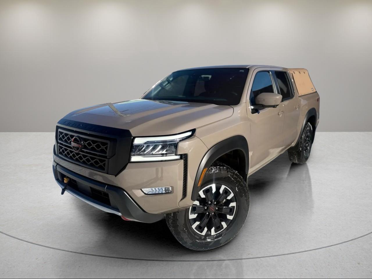<p>Experience the robust power of the 2024 Nissan Frontier Crew Cab 4x4 PRO-4X, now available in a striking Tan finish. This rugged truck is built to conquer the road with its 4x4 drivetrain and precise handling, making every journey both smooth and exciting.</p><p>With its bold exterior in a captivating color, this Frontier stands out on any terrain. Step inside to find a sophisticated interior adorned in Black, offering key features such as heated seats and a leather steering wheel, ensuring comfort on all your adventures. Alloy wheels and heated mirrors round out the styling, enhancing both aesthetics and functionality.</p><p>Technology takes center stage in this Nissan with features like a backup camera, Bluetooth connection, and smart device integration. Enjoy peace of mind with lane assist, parking sensors, and adaptive cruise control, supporting a safe driving experience for you and your passengers.</p><p>This 2024 Nissan Frontier PRO-4X is perfect for those who value power, style, and technology in a truck. Ready to elevate your driving experience? Contact us today to learn more and schedule a test drive.</p>