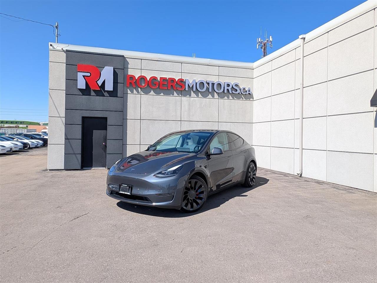 <p>Limited Time Offer: Financing at 5.99% / 6 Months Payment Deferral / $0 Down Payment / Private Viewings Available / Appointments Preferred / Online Purchase and FREE Delivery Available / Curbside Pick Up Available<br/><br/><br/>PERFORMANCE AWD / WHITE INTERIOR / NAVIGATION / BLINDSPOT ASSIST / FRONT COLLISION WARNING / LANE ASSIST / 360 CAMERA / PANORAMIC ROOF / BLUETOOTH / HEATED SEATS & STEERING / SMART KEY / And More...<br/><br/><br/>While walk-ins are welcome, we encourage scheduling appointments for a smoother and more personalized experience.<br/><br/><br/>This 2022 Tesla Model Y is equipped with luxury features including Navigation, Sunroof, Leather, Power Windows, Power Locks, Heated Seats, Bluetooth Connectivity, Premium Sound System, and much more. Meticulously maintained, both the exterior and interior are in great condition. Prices are subject to taxes, certification, and licensing. Trade-ins are welcomed.<br/><br/><br/>Financing Available For All Credit Types Starting at 5.99% O.A.C. Up To 6 Months Payment Deferral Available. Our financing options cater to individuals with good, bad, or no credit history. Additionally, we offer up to 6 months with no payments and completely open loans with no early repayment fees. Our streamlined credit application process ensures quick approvals. Same-day delivery options are also accessible.<br/><br/><br/>Our state-of-the-art 10,000 square foot auto service center is staffed with licensed mechanics and is open to the public. From routine maintenance like oil changes and brake services to major repairs such as engine replacements, our service center caters to all automotive needs. Loaner vehicles are available for extended service requirements.<br/><br/><br/>We are Oakvilles premier destination for rust proofing services. Schedule an appointment to protect your vehicle from corrosion.<br/><br/><br/>Experience Excellence at Rogers Motors. Rogers Motors proudly stands as Oakvilles largest used car dealership, renowned for providing top-quality used vehicles including cars, trucks, SUVs, and minivans. Family-owned and operated since 2004, with over 10,000 vehicles sold, we are committed to delivering exceptional service.<br/><br/><br/>At Rogers Motors, we prioritize customer satisfaction above all else. With a focus on love, honesty, integrity, and transparency, we strive to ensure that every guest leaves our dealership happier than when they arrived. With an average rating of 4.9/5 from over 1000 online reviews, we invite you to experience car shopping and service the way it should be.<br/><br/><br/>Rogers Motors. Driving Happiness.<br/>Visit our website to see all our current inventory.<br/></p>