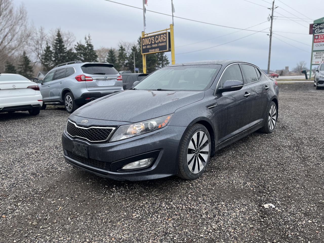 <p>*CERTIFIED,</p><p>We finance</p><p>Contact us for pre approval,</p><p>DINOS CARS</p><p>-Safety certification included in the price ( UNLESS SPECIFIED OTHERWISE ie. AS IS VEHICLES)</p><p>-IF YOU CANT COME TO US WELL DRIVE TO YOU ( WITHIN A REASONABLE DISTANCE TO VIEW) DELIVERY ALSO AVAILABLE</p><p>-Certified Quality Pre owned Vehicles</p><p>-Carfax history report available for every vehicle</p><p>-Licensing and tax are extra</p><p>-Open by Appointment Call or text(519)697-3866</p><p>-4016 Dundas St E, London, ON N5V 5C6</p><p>Looking for a stylish and sporty sedan that offers a premium driving experience? Then check out this sleek 2012 Kia Optima SX, available now at Dinos Cars! This head-turning gray Optima boasts a sophisticated black interior and is ready to impress with its dynamic performance and refined features. This well-maintained Optima has 149,280km on the odometer and is eager to hit the open road with its next owner.</p><p>The 2012 Kia Optima SX is more than just a car; its a statement. It&rsquo;s a sedan designed for those who appreciate both comfort and excitement. With its automatic transmission and front-wheel drive, this Optima offers a smooth and engaging ride, perfect for navigating city streets or cruising on the highway. Dont miss the opportunity to experience the blend of style, performance, and value that the Kia Optima SX brings.</p><p>Here are five features that make this 2012 Kia Optima SX a standout:</p><ul><li><strong>Sporty SX Trim:</strong> Enjoy a driving experience that&rsquo;s anything but ordinary with the top-of-the-line SX trim, offering enhanced performance and styling.</li><li><strong>Sleek Sedan Design:</strong> Turn heads wherever you go with the Optimas modern and stylish sedan design.</li><li><strong>Automatic Transmission:</strong> Experience effortless driving with the smooth and responsive automatic transmission.</li><li><strong>Comfortable Interior:</strong> Relax and enjoy the ride in the Optimas comfortable black interior.</li><li><strong>Fuel-Efficient Performance:</strong> Get great gas mileage with this fuel-efficient gasoline-powered sedan.</li></ul><p><strong><em>Powered by AutoIntelligence&trade;</em></strong> Vehicle information has been generated using artificial intelligence and is provided for informational purposes only. While efforts are made to ensure accuracy, please confirm all details directly with the dealer.</p>