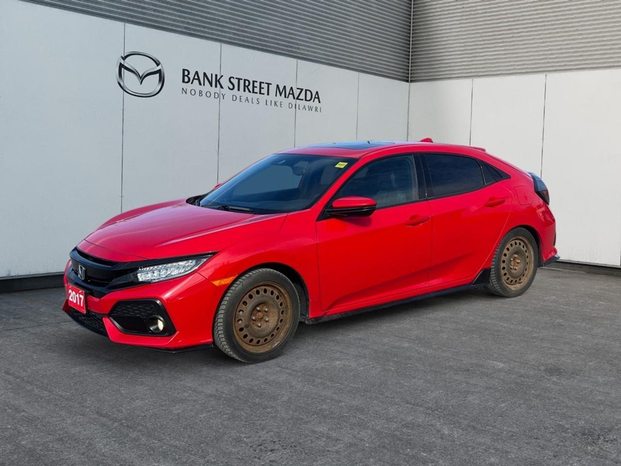 The 2017 Honda Civic Hatchback Sport Touring in an eye-catching Red with a smooth FWD drivetrain and sporty Manual transmission is ready to make a statement on the road. This dynamic sedan offers superior handling for those who enjoy a more connected driving experience. Its exterior turns heads with its vibrant color and elegant alloy wheels, while the expressive design includes a sunroof, which promises an open sky view during your adventures. Inside, the Civic Hatchback combines style with comfort, boasting luxurious leather seating and a leather steering wheel that add a touch of sophistication. Both heated front and rear seats cater to comfort in cooler weather. This Civic packs in advanced technology features like a navigation system and smart device integration, ensuring you stay on route and connected. Safety and convenience are amplified with options like a backup camera, lane assist, and adaptive cruise control, all making your drive smarter and safer. Plus, enjoy your favorite tunes with satellite radio and the rich acoustics they bring into your journey. This vehicle is perfect for tech-savvy individuals who appreciate a combination of sporty styling and practical features. Reach out to our dealership today and let us help you get behind the wheel of this impressive Civic Hatchback Sport Touring.