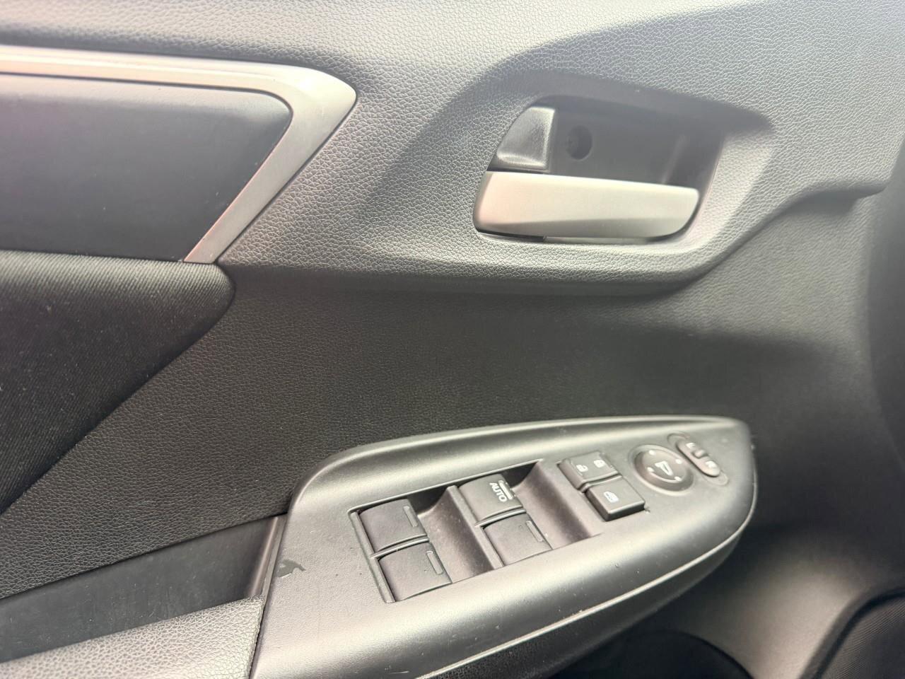 2016 Honda Fit LXLX, 1.5L 4-CYLINDER, HATCHBACK, FWD, CLOTH, SNOW Photo