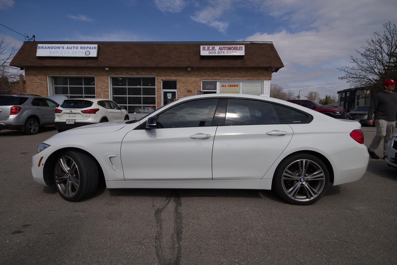 <p>Looking for a blend of performance and luxury? Feast your eyes on this stunning 2015 BMW 4 Series 428i xDrive, available now at R.E.R. Automobiles Ltd. This sleek sedan is a head-turner, boasting a crisp white exterior that perfectly complements its bold red interior. With the assurance of all-wheel drive, this vehicle is ready to take on the roads in any season. Showing 148,593km on the odometer, this BMW promises years of driving enjoyment.</p><p>This 4 Series 428i xDrive is equipped with several features designed to enhance your driving experience. Heres a taste of what awaits you:</p><ul><li><strong>Precision Handling:</strong> Experience the renowned BMW driving dynamics with its responsive steering and balanced chassis.</li><li><strong>Luxurious Interior:</strong> Sink into the supportive red leather seats and enjoy the premium materials that surround you.</li><li><strong>All-Wheel Drive Confidence:</strong> Conquer any weather condition with the added grip and stability of the xDrive system.</li><li><strong>Advanced Technology:</strong> Stay connected and entertained with the integrated infotainment system.</li><li><strong>Sporty Aesthetics:</strong> Turn heads with the 4 Series signature design, combining elegance and athleticism.</li></ul><p><strong><em>Powered by AutoIntelligence&trade;</em></strong> Vehicle information has been generated using artificial intelligence and is provided for informational purposes only. While efforts are made to ensure accuracy, please confirm all details directly with the dealer.</p>