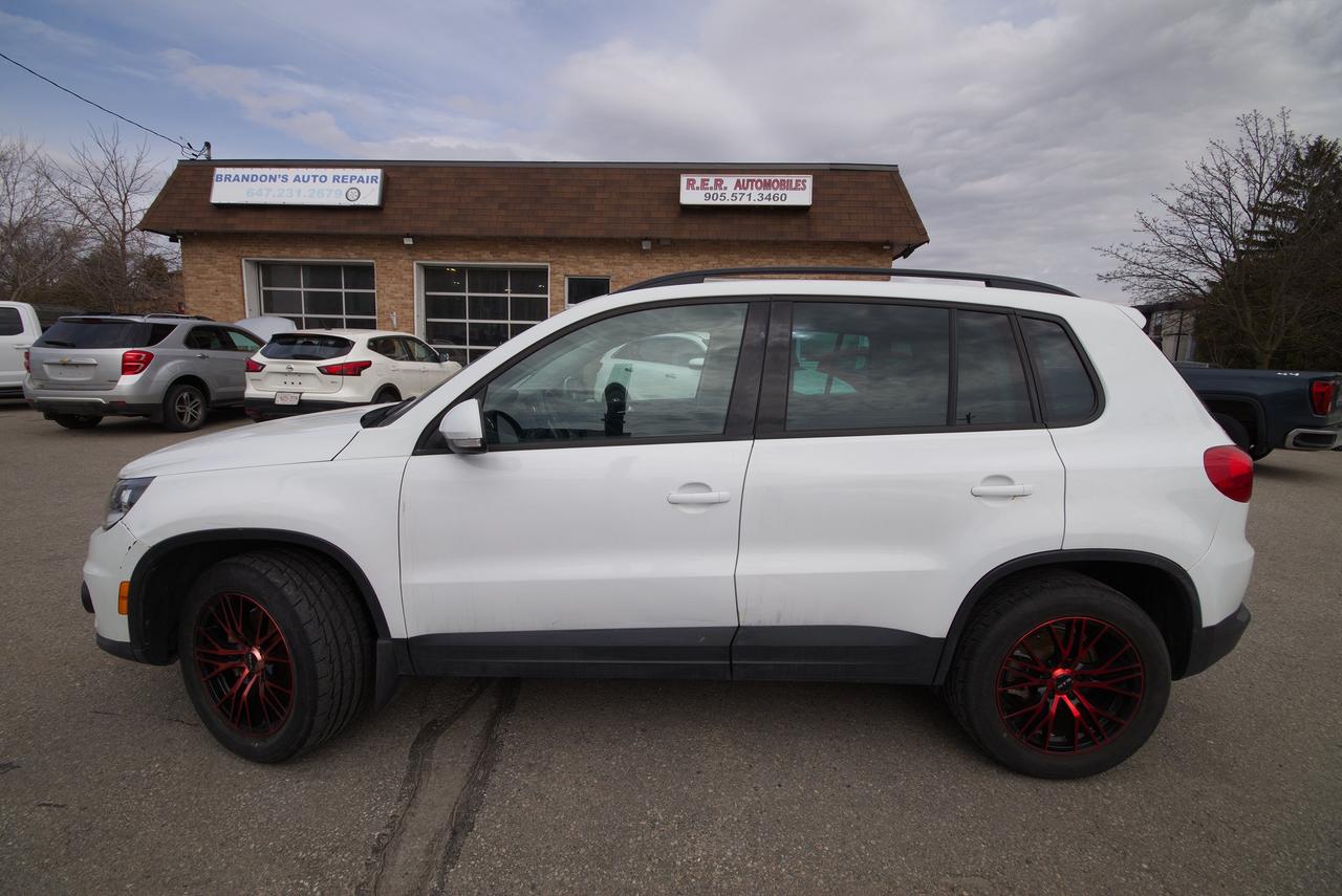<p>Looking for a versatile and capable SUV that can handle Canadas diverse driving conditions? Check out this pre-owned 2014 Volkswagen Tiguan Comfortline, available now at R.E.R. Automobiles Ltd. This compact SUV offers a comfortable ride, practical features, and the legendary Volkswagen reliability you can count on. Perfect for city commutes or weekend adventures, the Tiguan Comfortline is ready to take you wherever you need to go.</p><p>This Tiguan boasts a fuel-efficient gasoline engine paired with a smooth-shifting automatic transmission. With its all-wheel-drive system, youll experience enhanced traction and control, making it ideal for navigating snowy roads or tackling off-the-beaten-path trails. Inside, youll find a well-appointed cabin designed with your comfort in mind. The Tiguan Comfortline is an excellent choice for drivers who value practicality, performance, and a touch of European flair.</p><p>Here are five features youll love about this Tiguan:</p><ul><li><strong>All-Wheel Drive:</strong> Conquer any weather condition with confidence, knowing you have superior grip and control.</li><li><strong>Automatic Transmission:</strong> Enjoy effortless driving with smooth and responsive gear changes.</li><li><strong>Versatile SUV Design:</strong> Benefit from ample cargo space and passenger room, making it perfect for families and active lifestyles.</li><li><strong>Fuel-Efficient Gasoline Engine:</strong> Save money at the pump with an engine designed for efficiency without sacrificing performance.</li><li><strong>Volkswagen Reliability:</strong> Experience the peace of mind that comes with owning a vehicle known for its longevity and quality.</li></ul><p><strong><em>Powered by AutoIntelligence&trade;</em></strong> Vehicle information has been generated using artificial intelligence and is provided for informational purposes only. While efforts are made to ensure accuracy, please confirm all details directly with the dealer.</p>